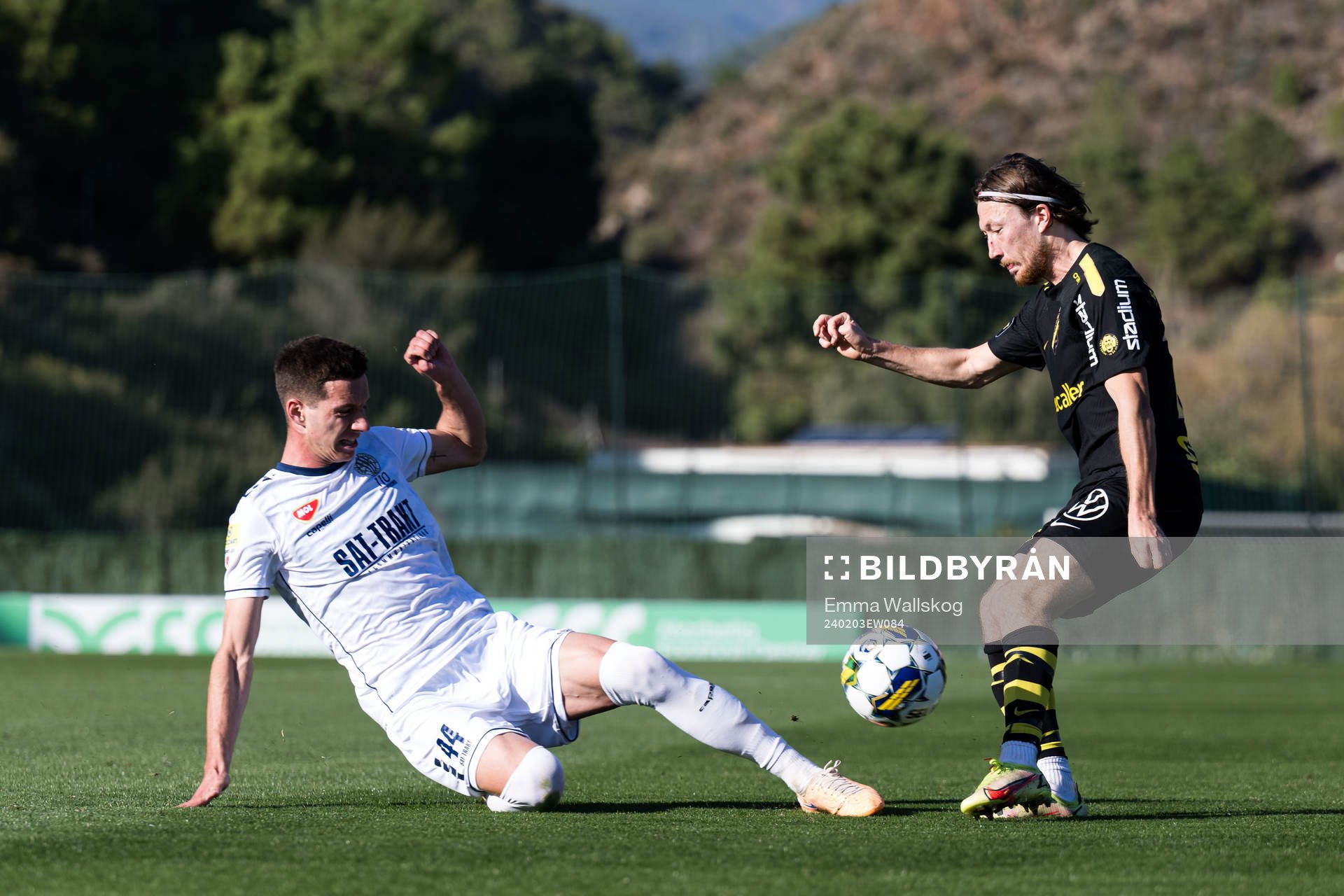 Vukasin Krstic of FK TSC Backa Topola and Axel Björnström