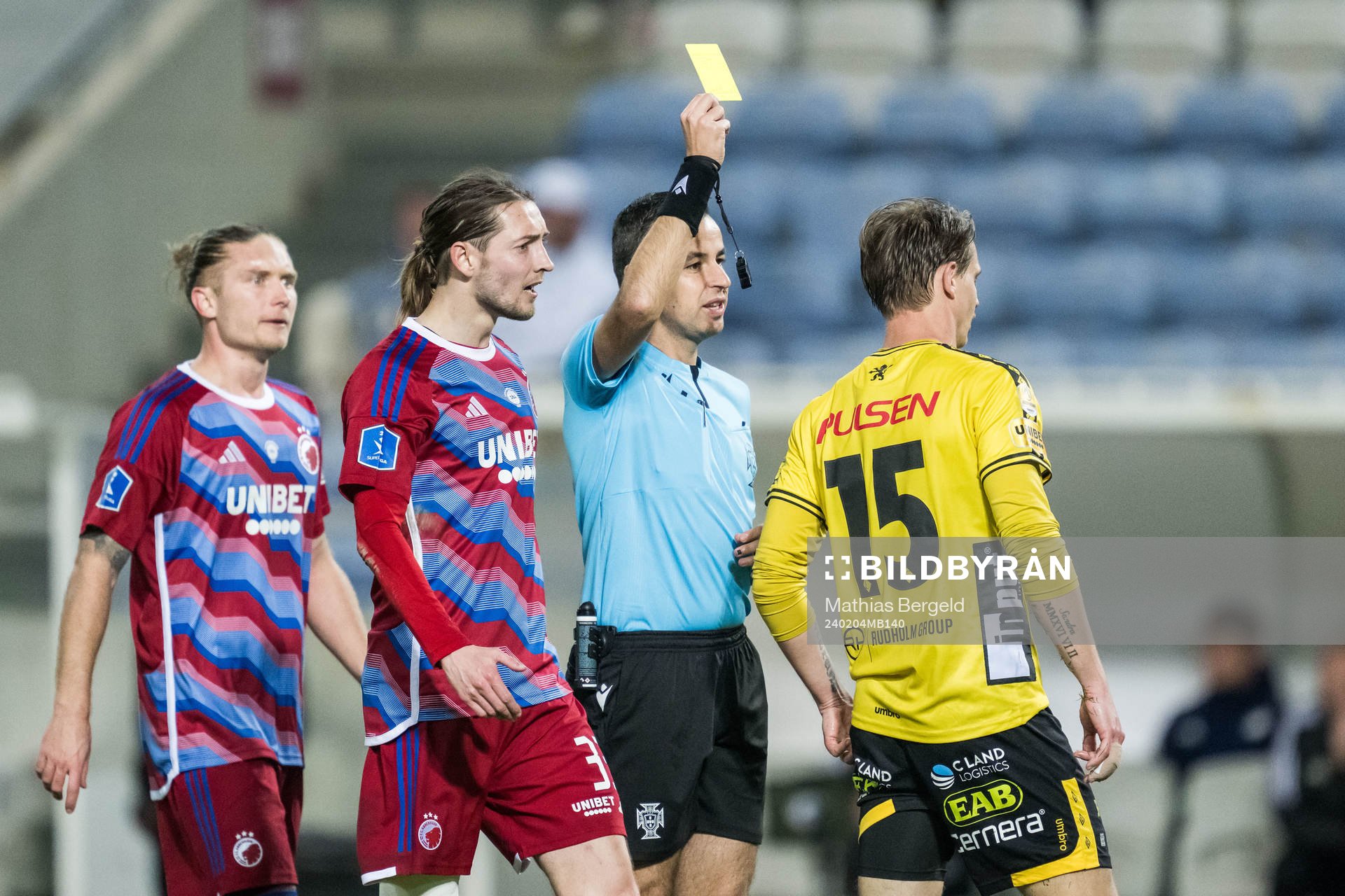 Referee Pedro Ramalho and Simon Hedlund of Elfsborg