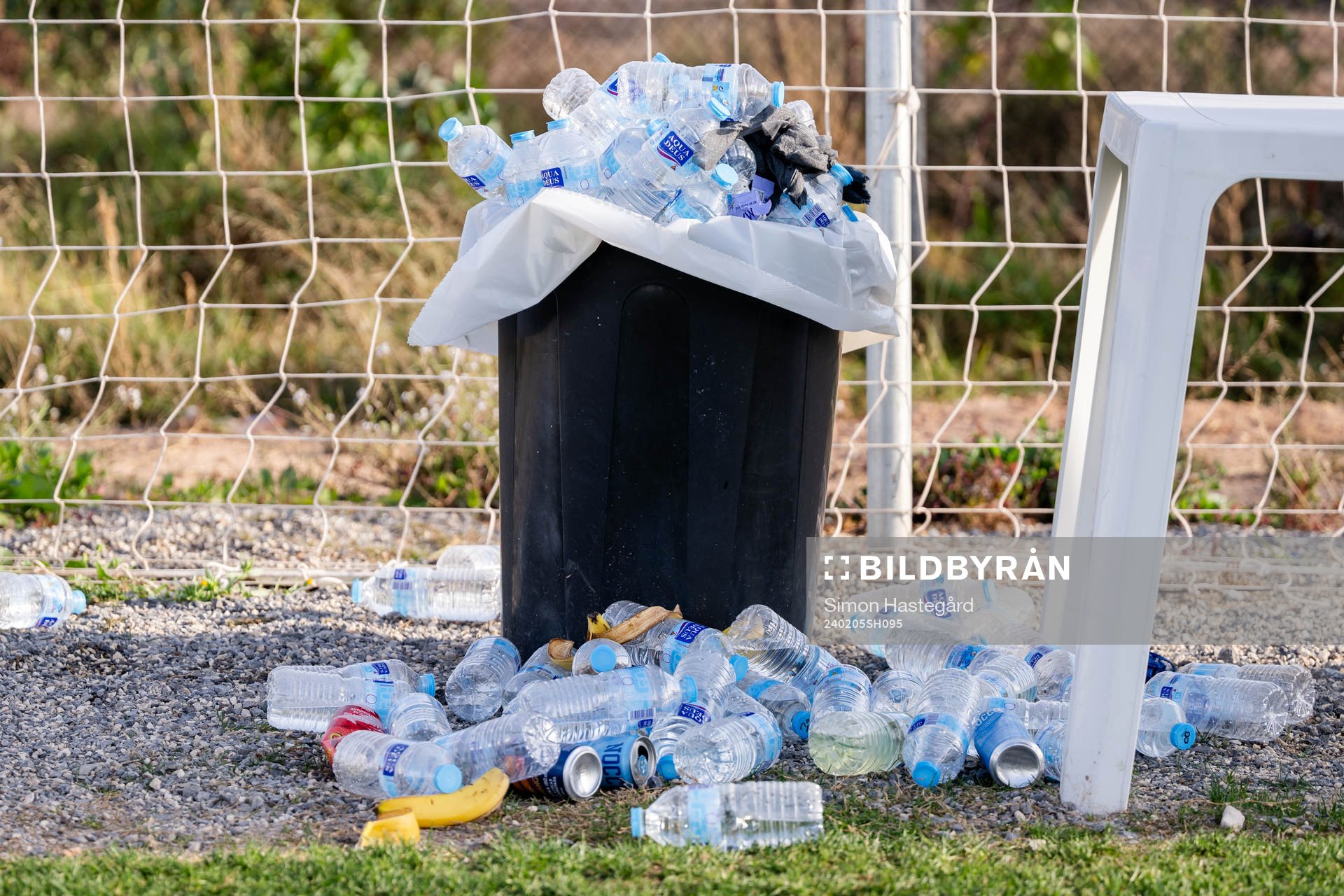 Waterbottles in a trash can