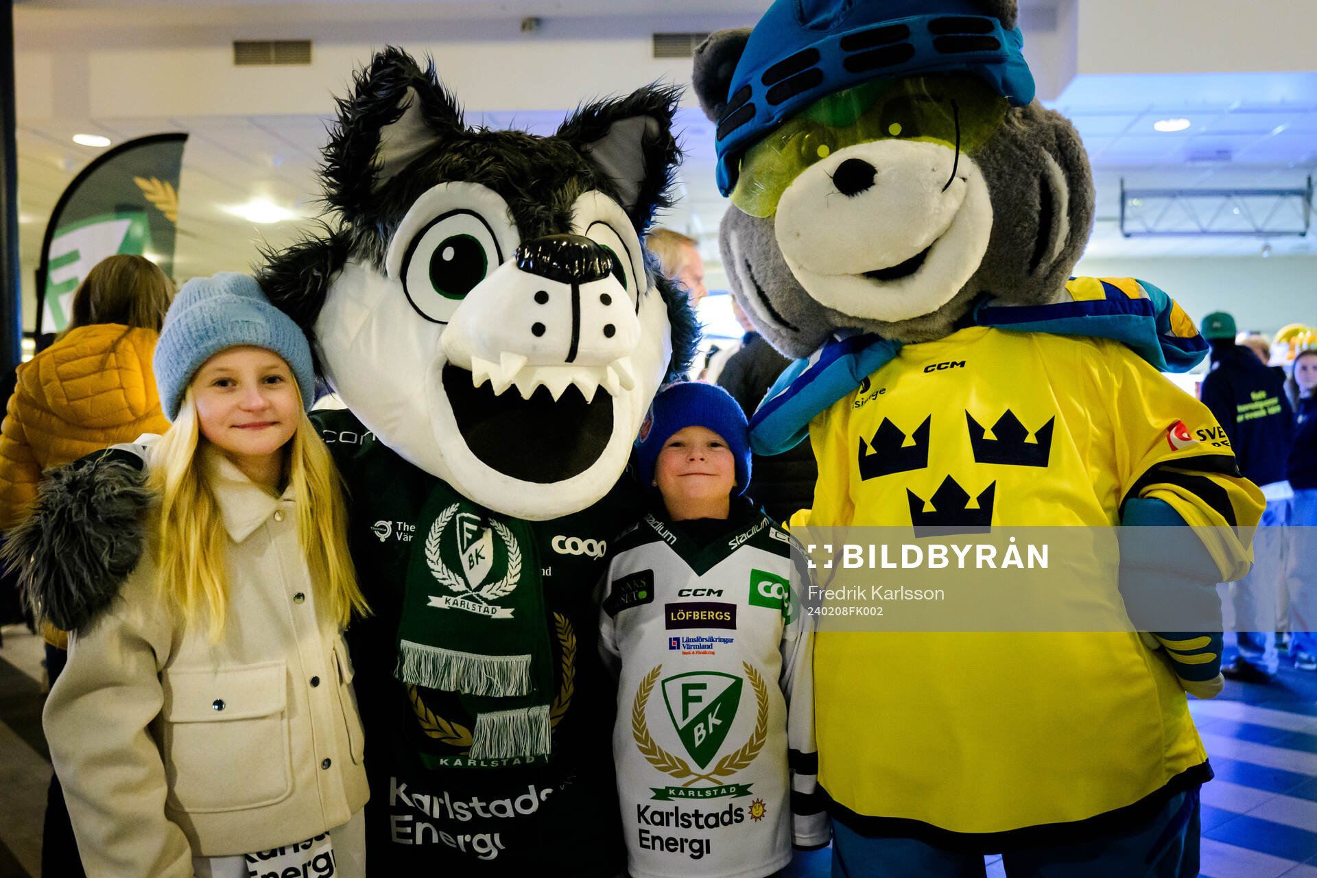 Supporters of Sweden with Färjestads mascot Ture Varg and