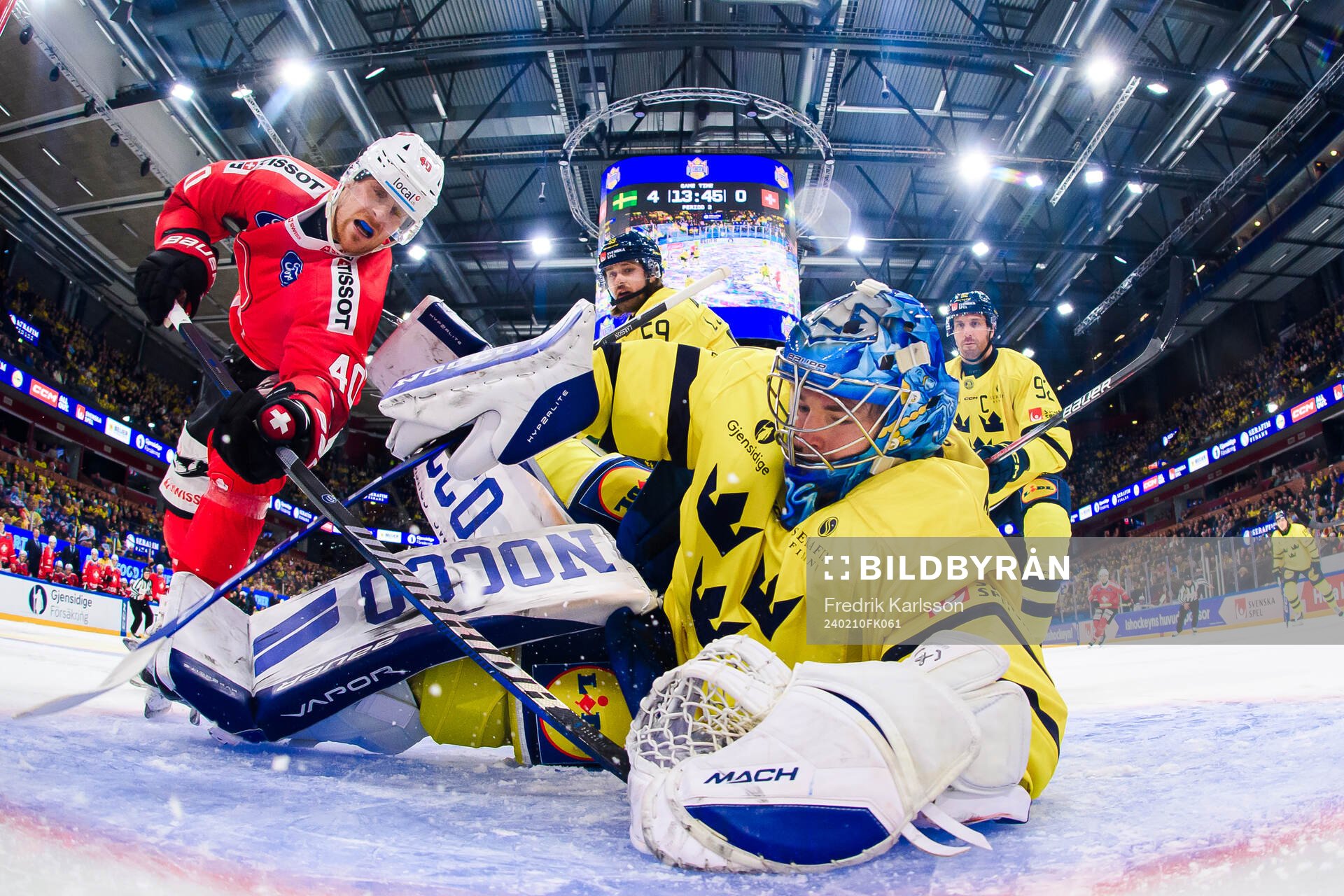 André Heim of Switzerland and goalkeeper Filip Larsson of