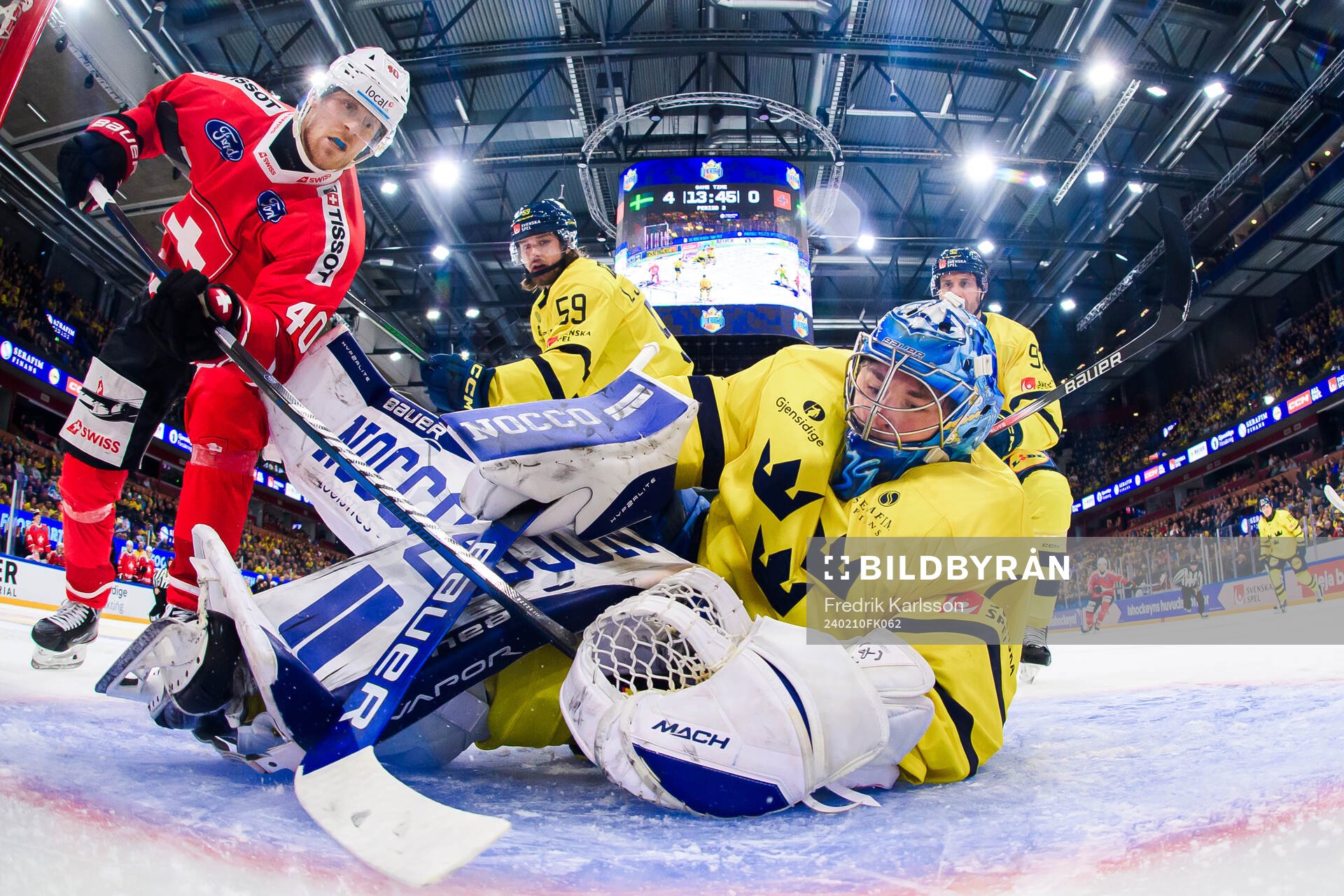 André Heim of Switzerland and goalkeeper Filip Larsson of