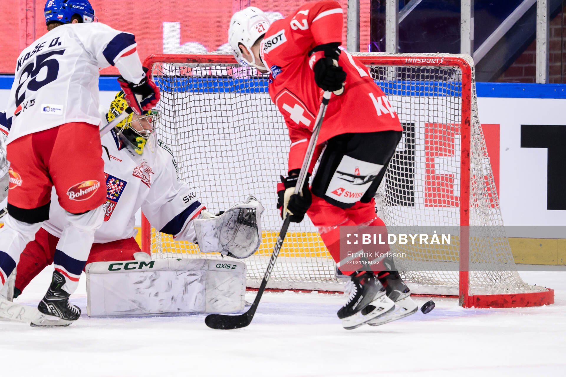 goaltender Jakub Málek of Czech Republic and Axel Simic of