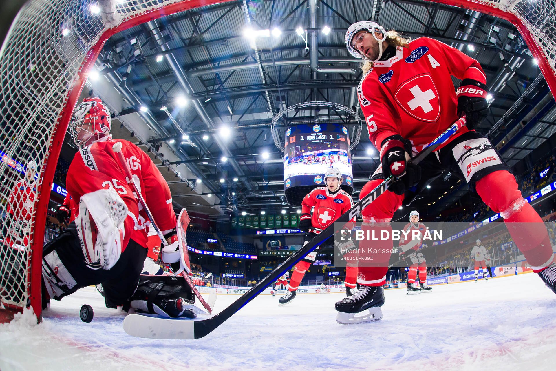 goalkeeper Connor Hughes and Michael Fora of Switzerland