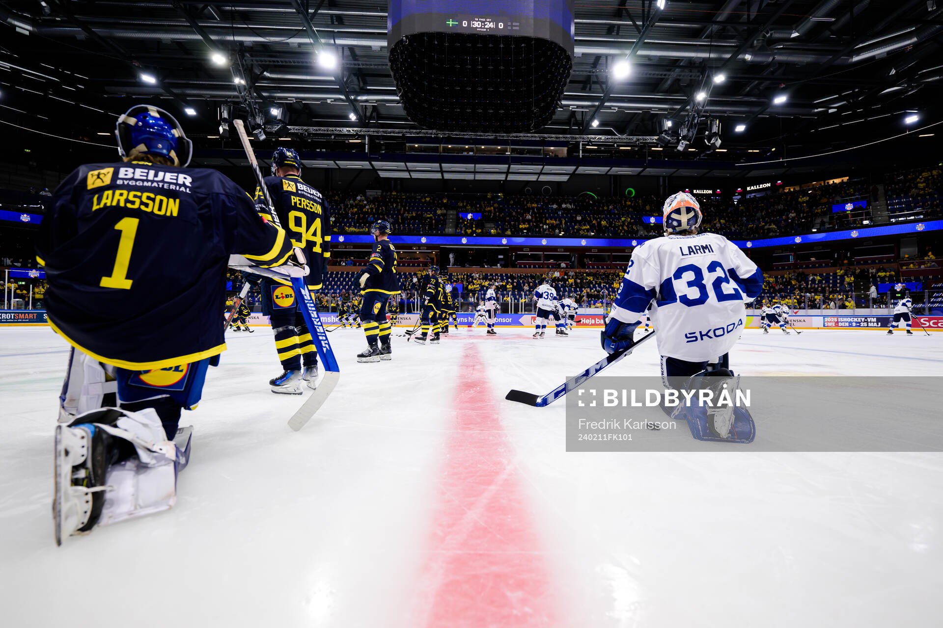 goalkeeper Filip Larsson of Sweden and goaltender Emil