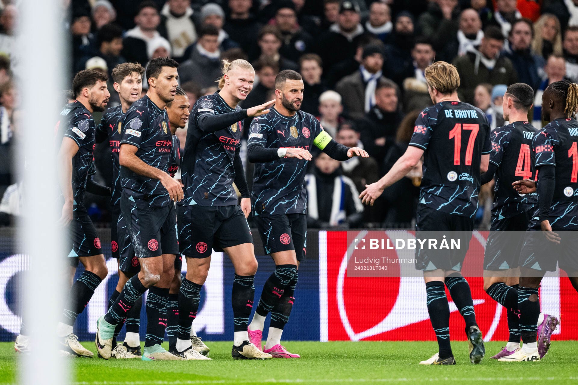 Bernardo Silva of Manchester City celebrates with Ruben Dias, John Stones, Nathan Aké, Erling Braut Haaland and Kyle Walker after 1-2 during the UEFA Champions League football 1/8 final between FC Copenhagen and Manchester City on February 13, 2024 in Copenhaugen.