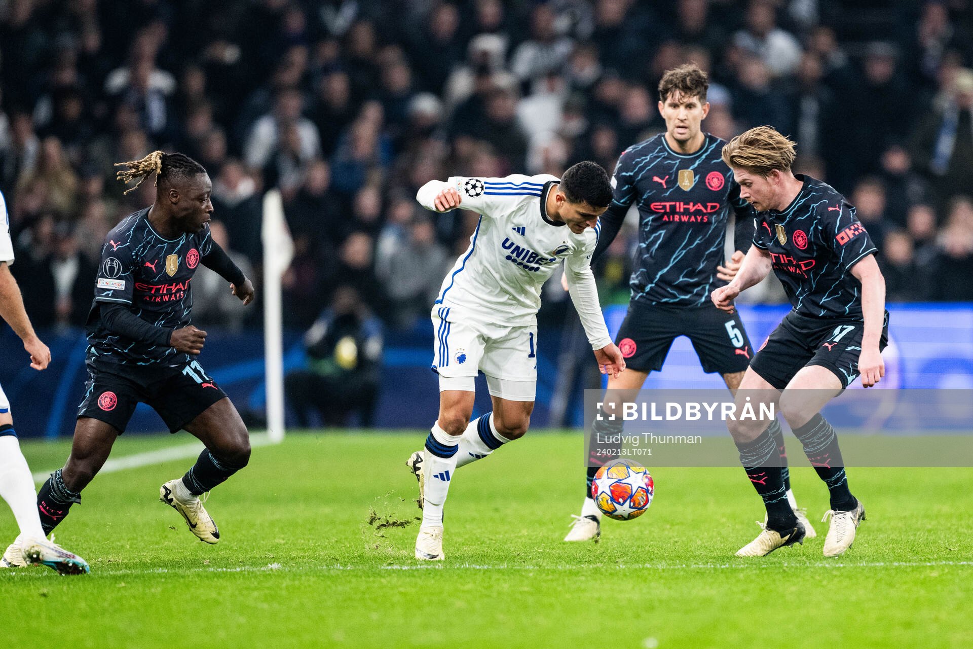 Jérémy Doku, John Stones and Kevin De Bruyne of