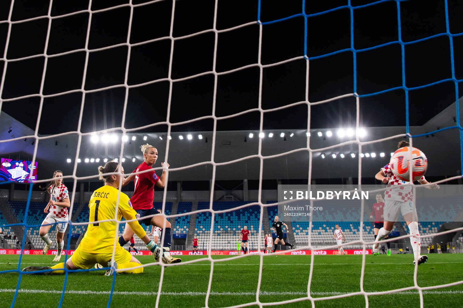 Celin Bizet Ildhusøy of Norway scores the 0-3 goal behind goalkeeper Doris Bacic of Croatia during tthe UEFA Women's Nations League play-off football match between Croatia and Norway on February 23, 2024 in Osijek.