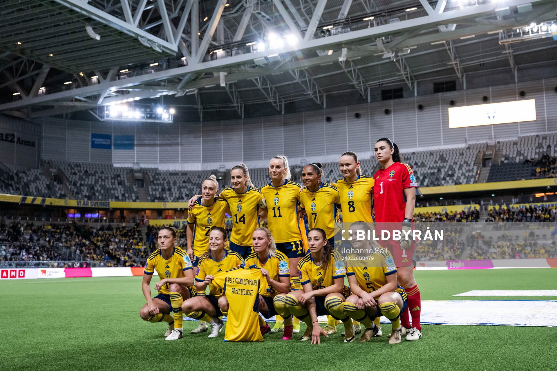 The starting eleven of Sweden pose for a photo as the hold a shirt with a message to Swedish player Kristoffer Olsson who is currently hospitalized ahead of the UEFA Women's Nations League negative qualification match between Sweden and Bosnia and Herzegovina on February 28, 2024 in Stockholm. From the top left: Hanna Bennison, Nathalie Björn, Stina Blackstenius, Madelen Janogy, Matilda Vinberg, goalkeeper Zecira Musovic, Filippa Angeldahl, Anna Anvegård, Rusul Rosa Kafaji and Amanda Nildén.
