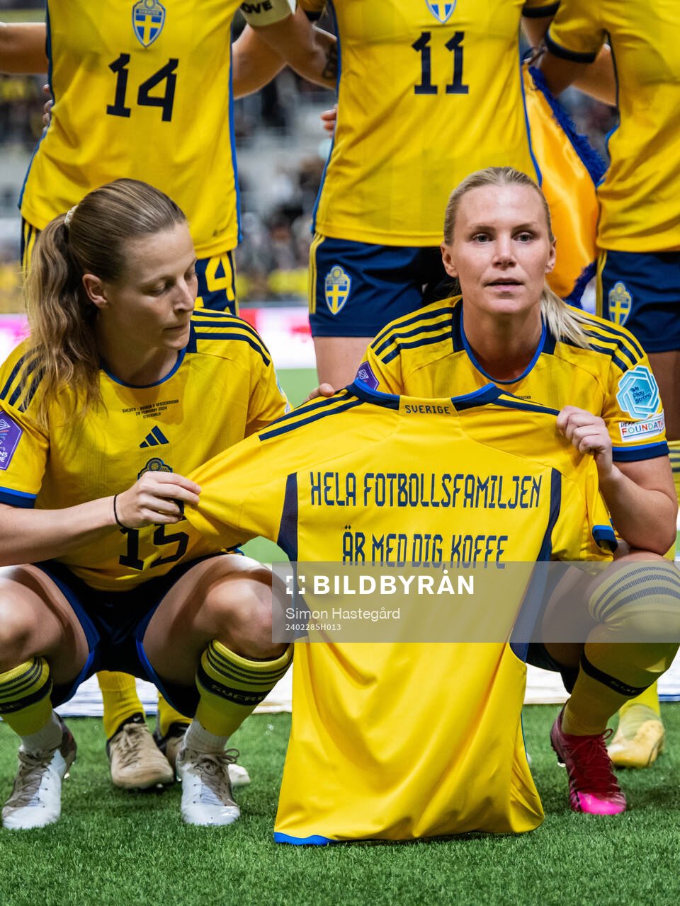 Anna Anvegård and Josefine Rybrink of Sweden pose for a photo as the hold a shirt with a message to Swedish player Kristoffer Olsson who is currently hospitalized during the UEFA Women's Nations League negative qualification match between Sweden and Bosnia and Herzegovina on February 28, 2024 in Stockholm.