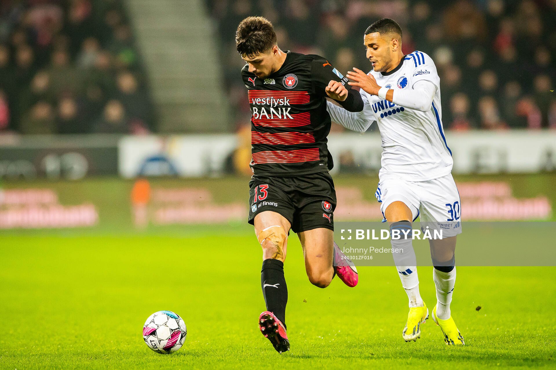 Adam Gabriel of Midtjylland and Elias Achouri of FC
