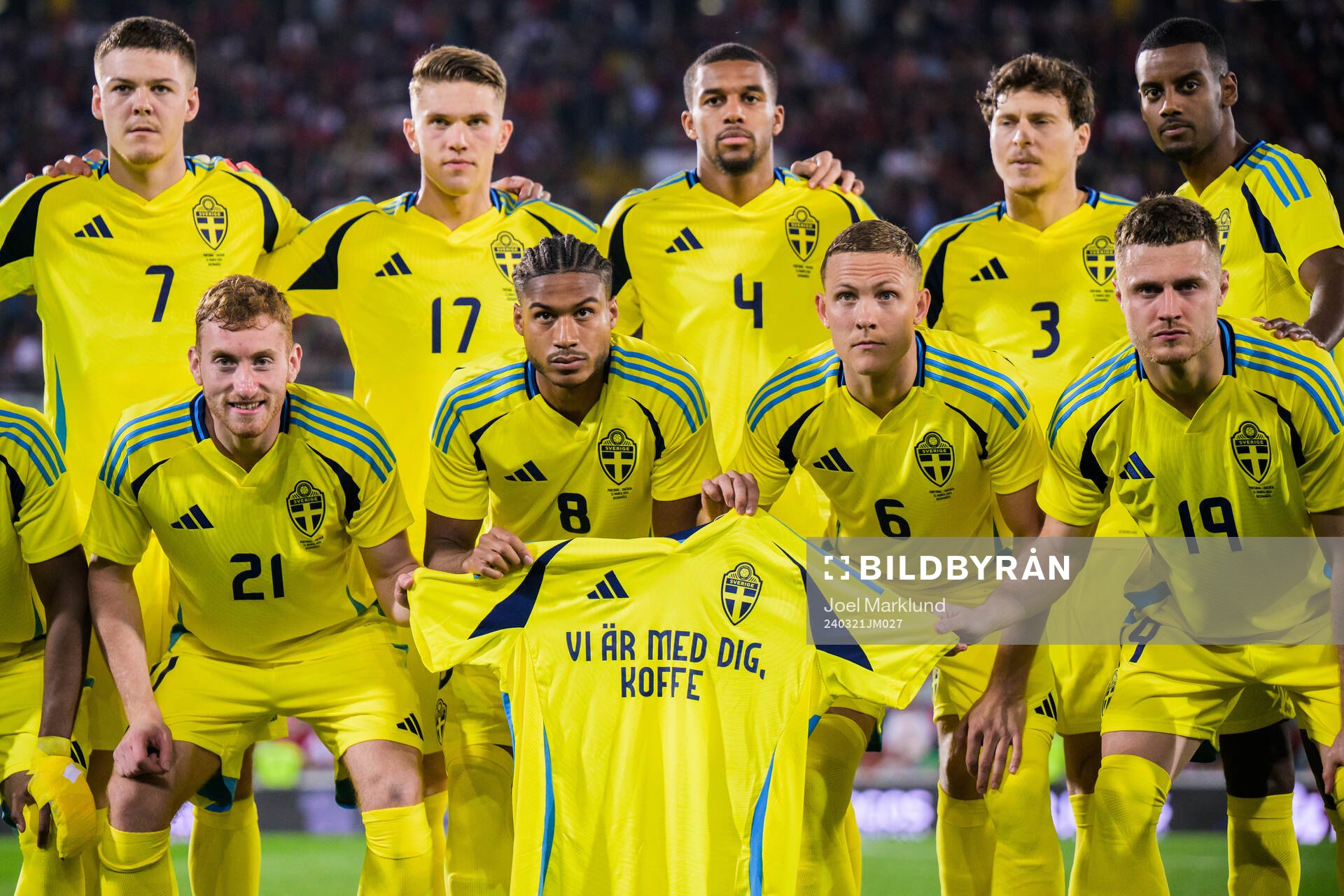 The starting eleven of Sweden pose for a photo as they hold