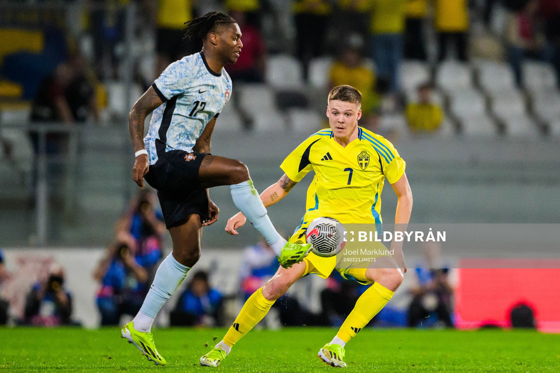 Rafael Leao of Portugal and Emil Holm of Sweden