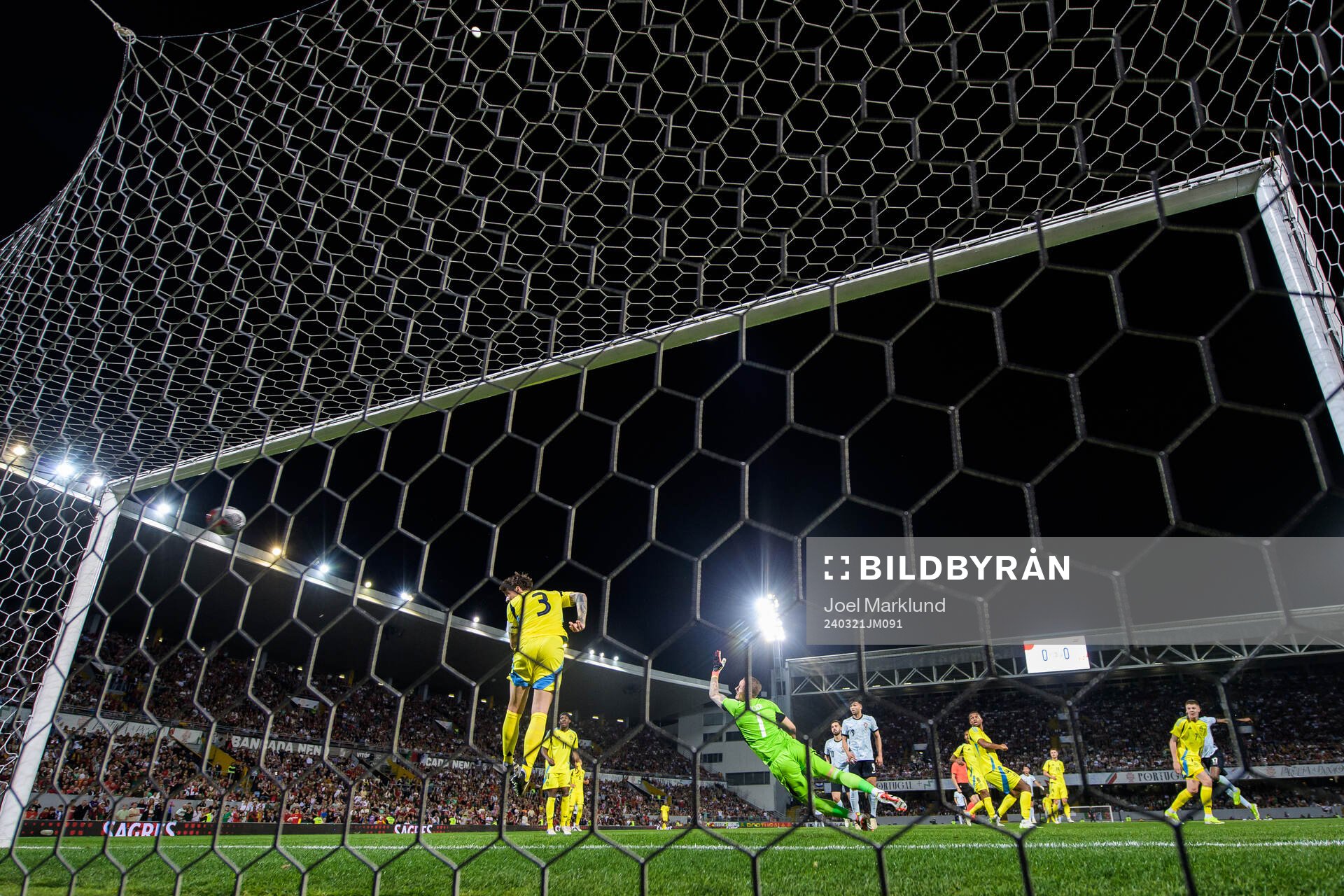 Goalkeeper Robin Olsen of Sweden lets in the 1-0 goal by