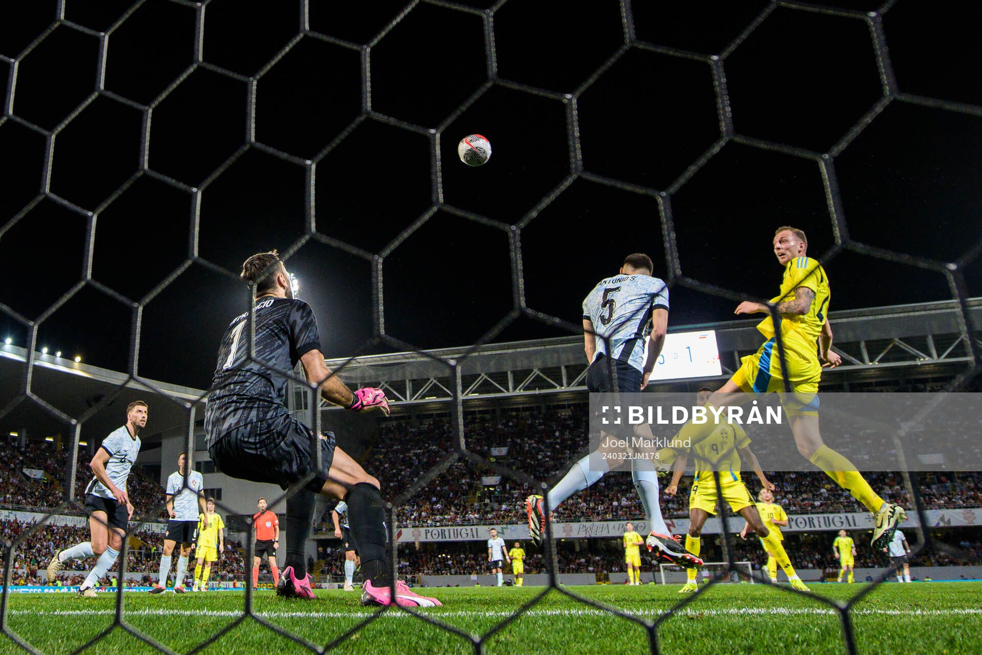 Gustaf Nilsson of Sweden scores 5-2 behind goalkeeper Rui