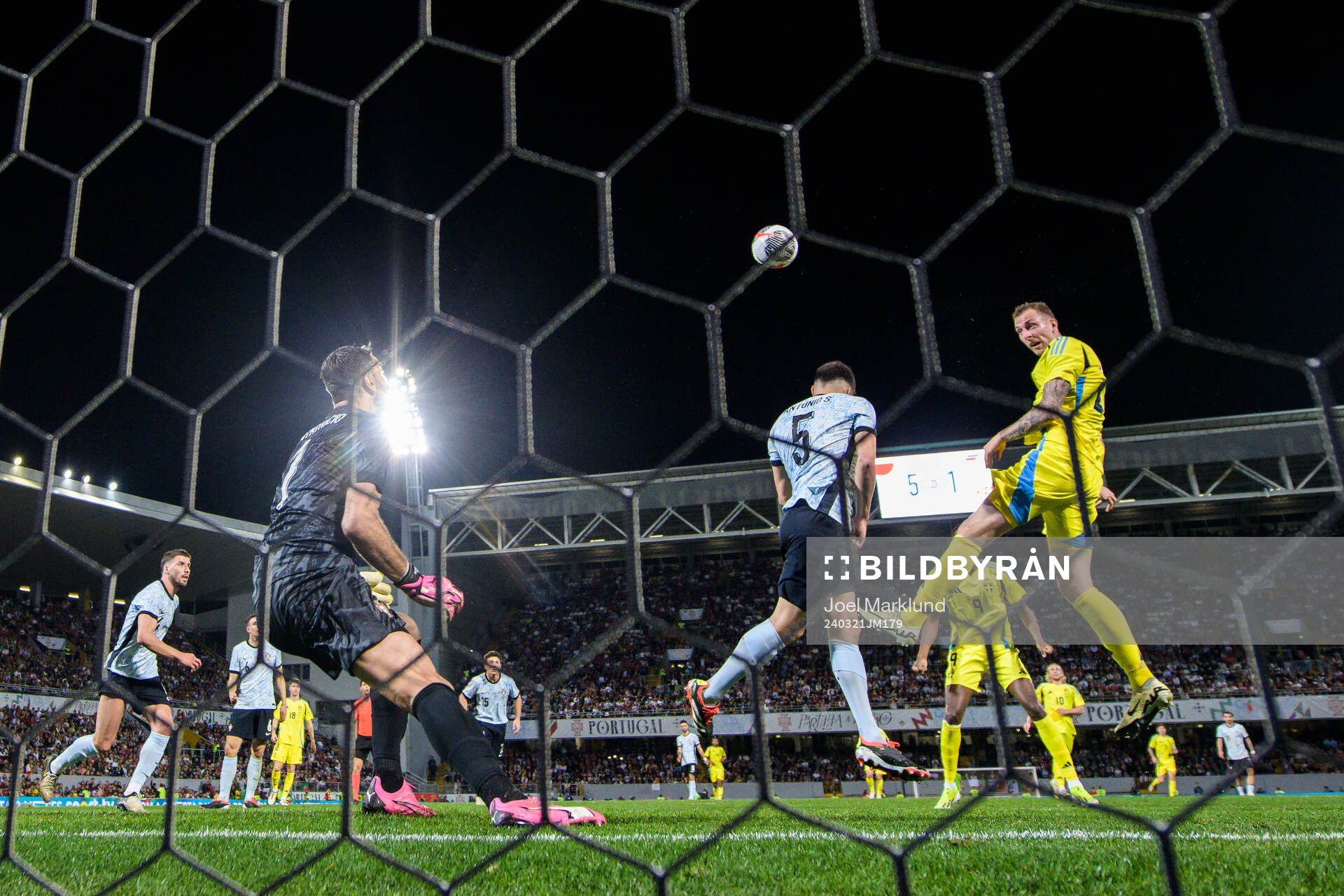 Gustaf Nilsson of Sweden scores 5-2 behind goalkeeper Rui Patricio of Portugal during the international friendly football match between Portugal and Sweden on March 21, 2024 in Guimaraes. 