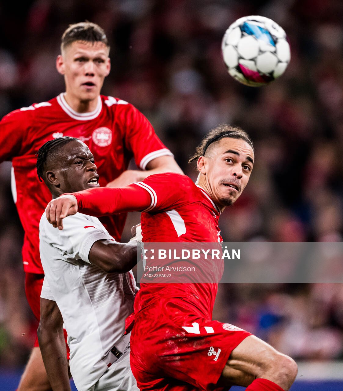 Yussuf Poulsen of Denmark and Danis Zakaria of Switzerland