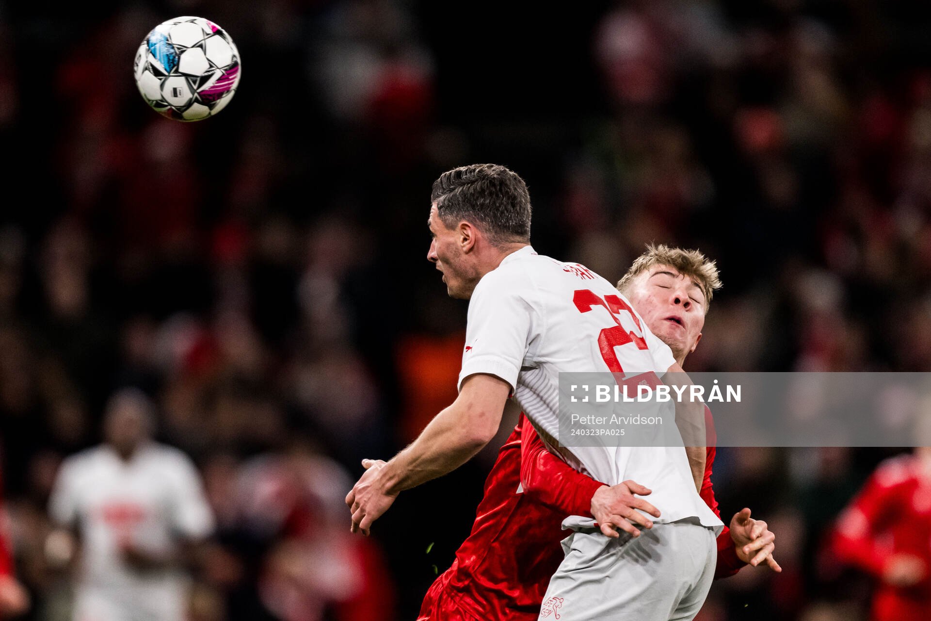 Fabian Schär of Switzerland and Rasmus Højlund of Denmark