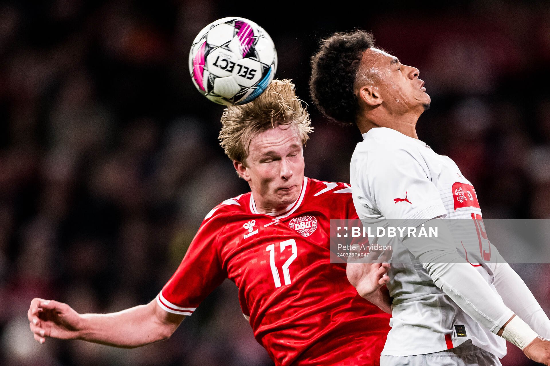 Victor Kristiansen of Denmark and Dan Ndoye of Switzerland