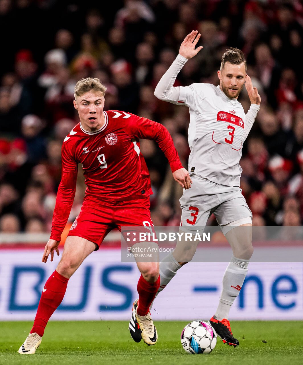 Rasmus Højlund of Denmark and Silvan Widmer of Switzerland during the international friendly football match between Denmark and Switzerland on March 23, 2024 in Copenhagen.