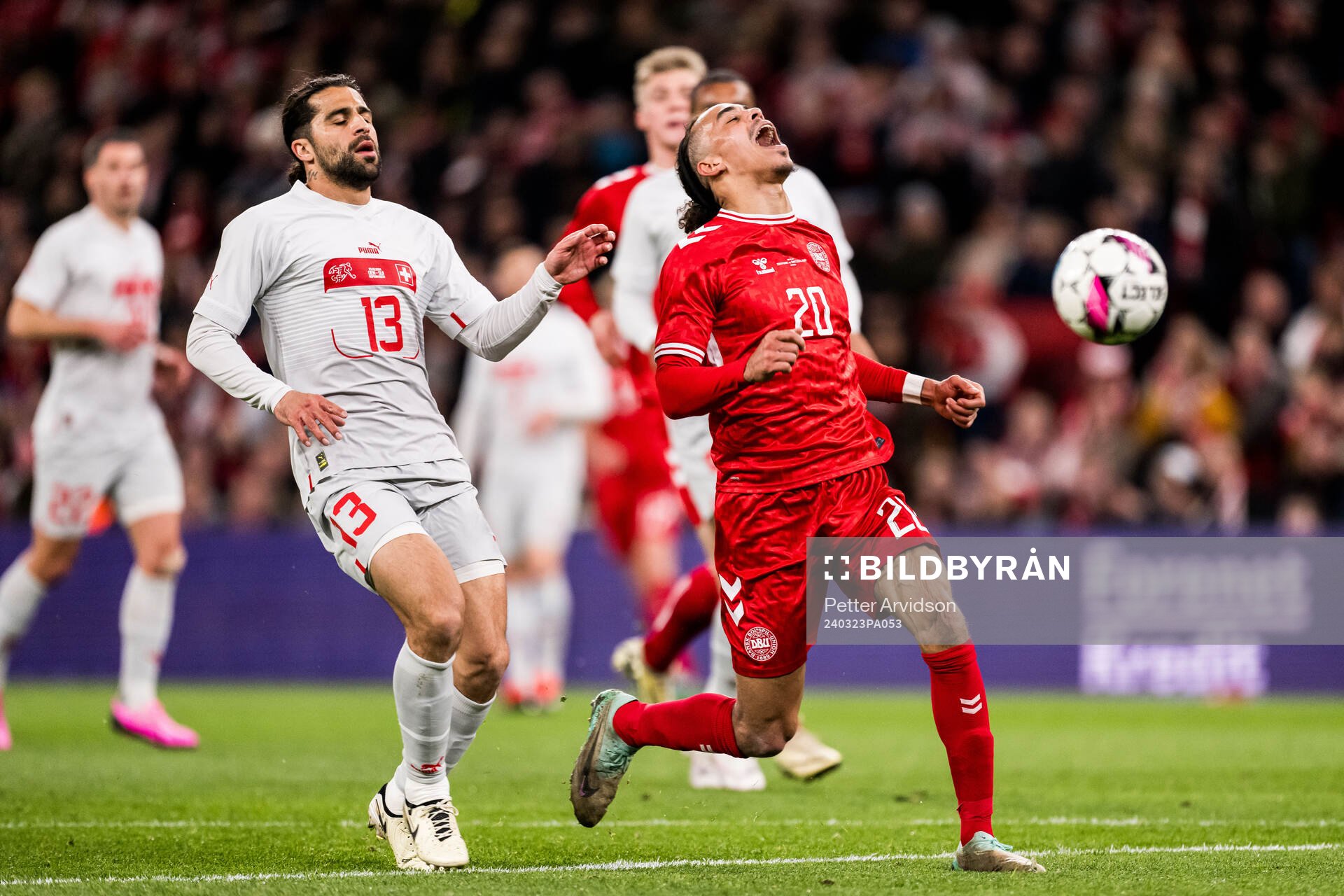 Ricardo Rodriguez of Switzerland and Yussuf Poulsen of