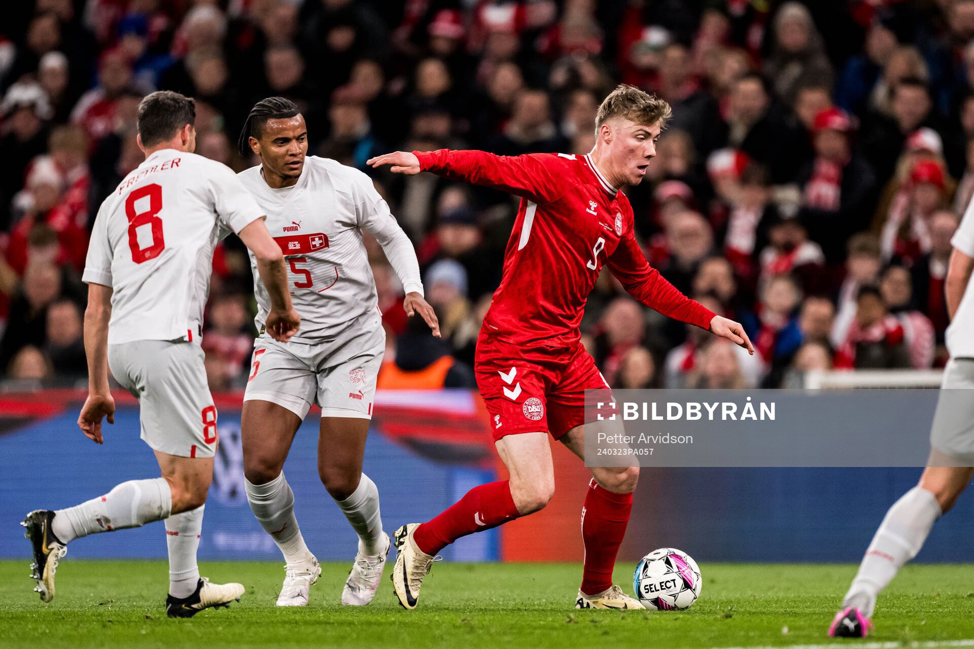 Rasmus Højlund of Denmark and Manuel Akanji of Switzerland