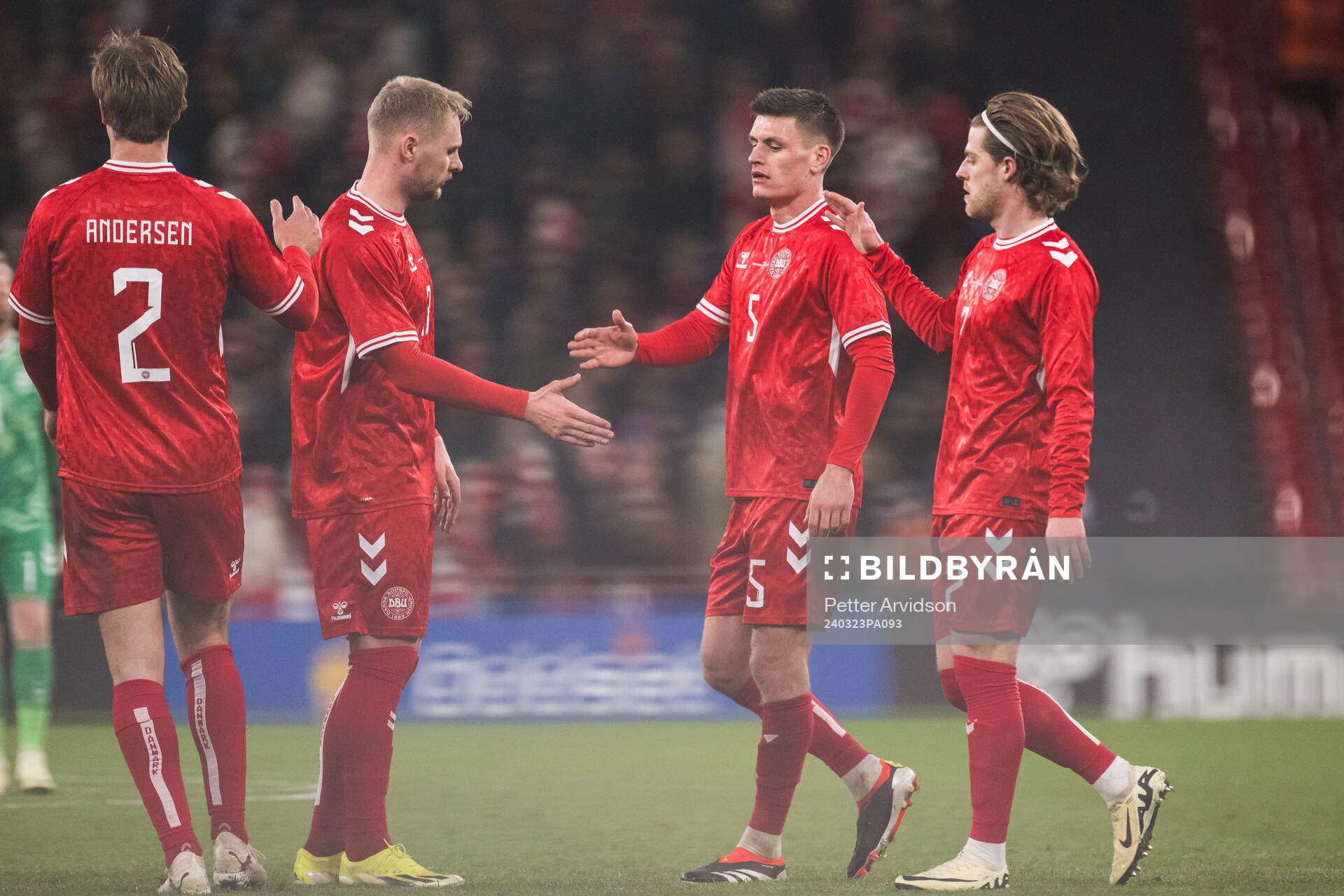Joakim Mæhle and Mathias Jensen of Denmark looks dejected