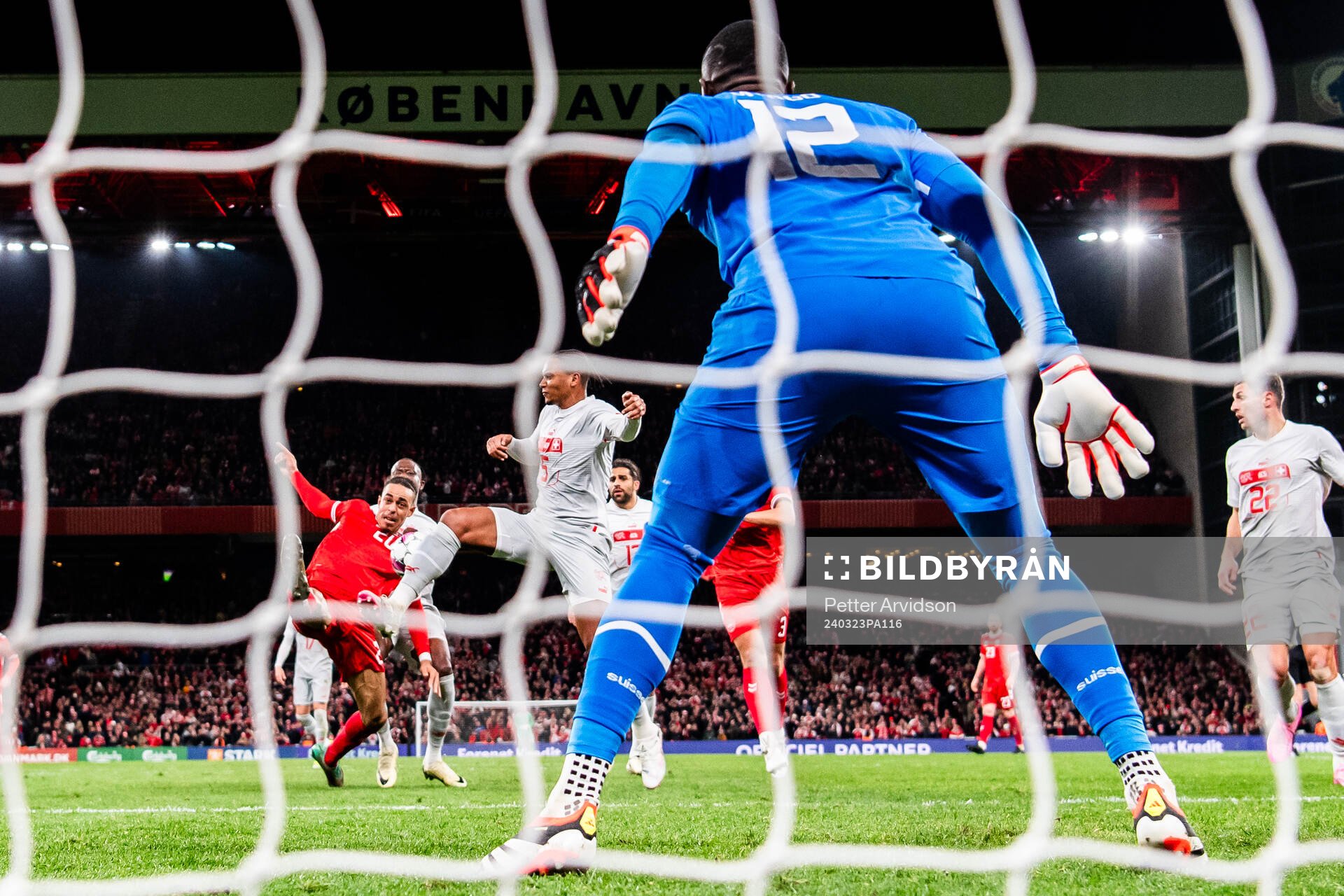 Yussuf Poulsen of Denmark in action against Manuel Akanji