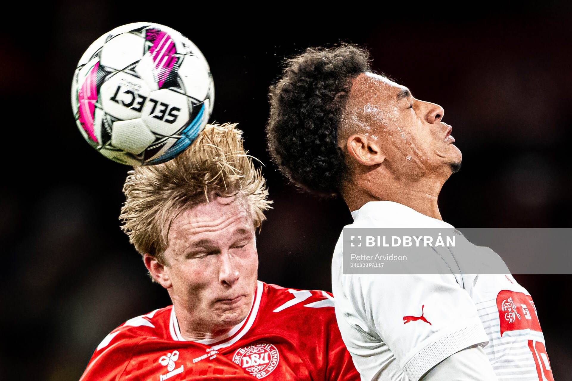 Victor Kristiansen of Denmark and Dan Ndoye of Switzerland