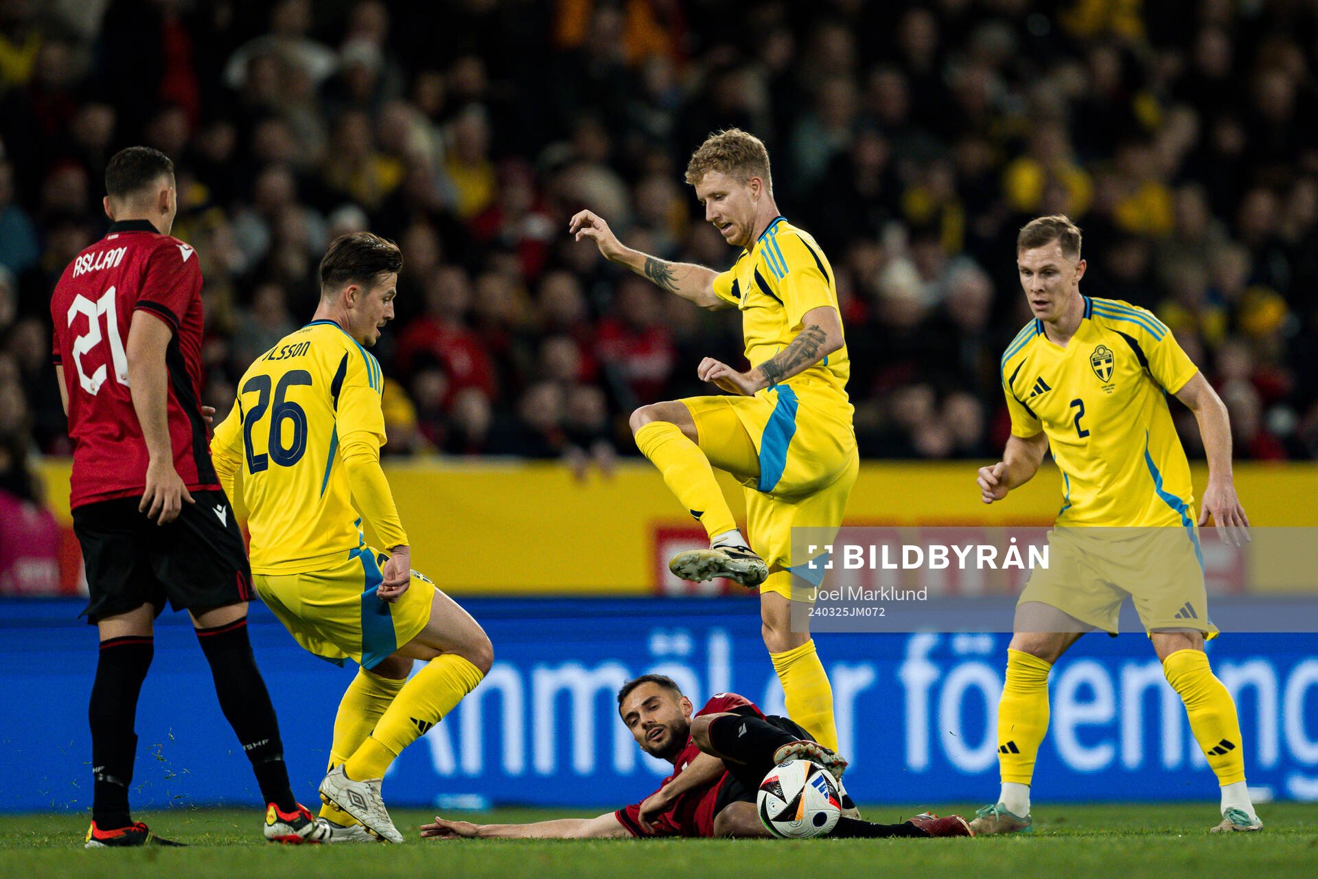 Simon Olsson, Samuel Gustafson and Emil Krafth of Sweden against Nedim Bajrami of Albania during the international friendly football match between Sweden and Albania on March 25, 2024 in Stockholm.