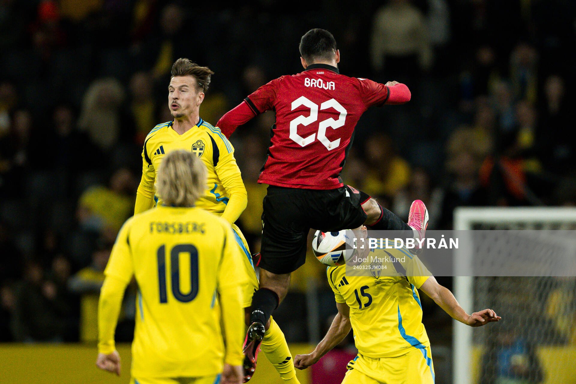 Simon Olsson and Carl Starfelt of Sweden and Armando Broja