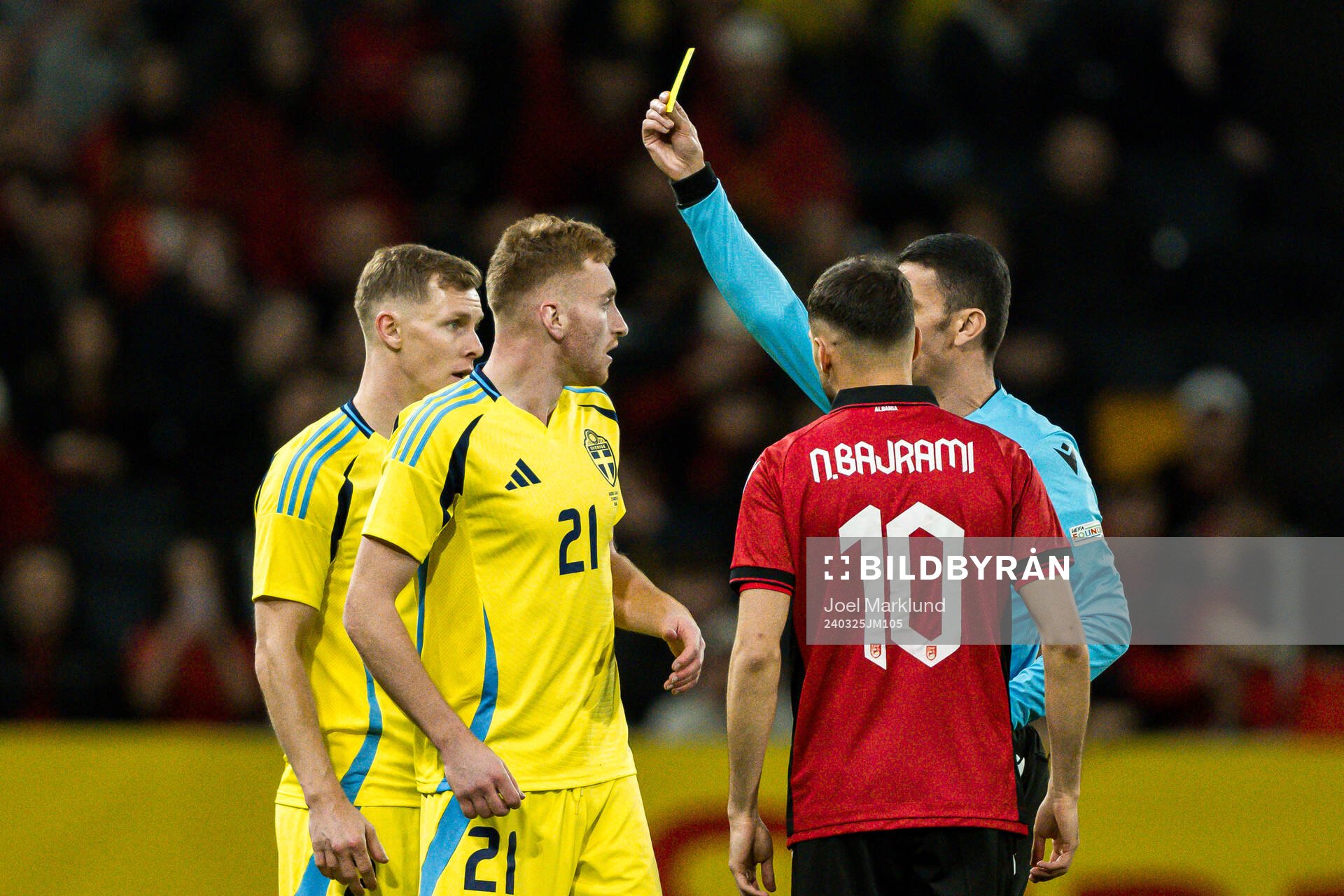 Dejan Kulusevski of Sweden receives a yellow card