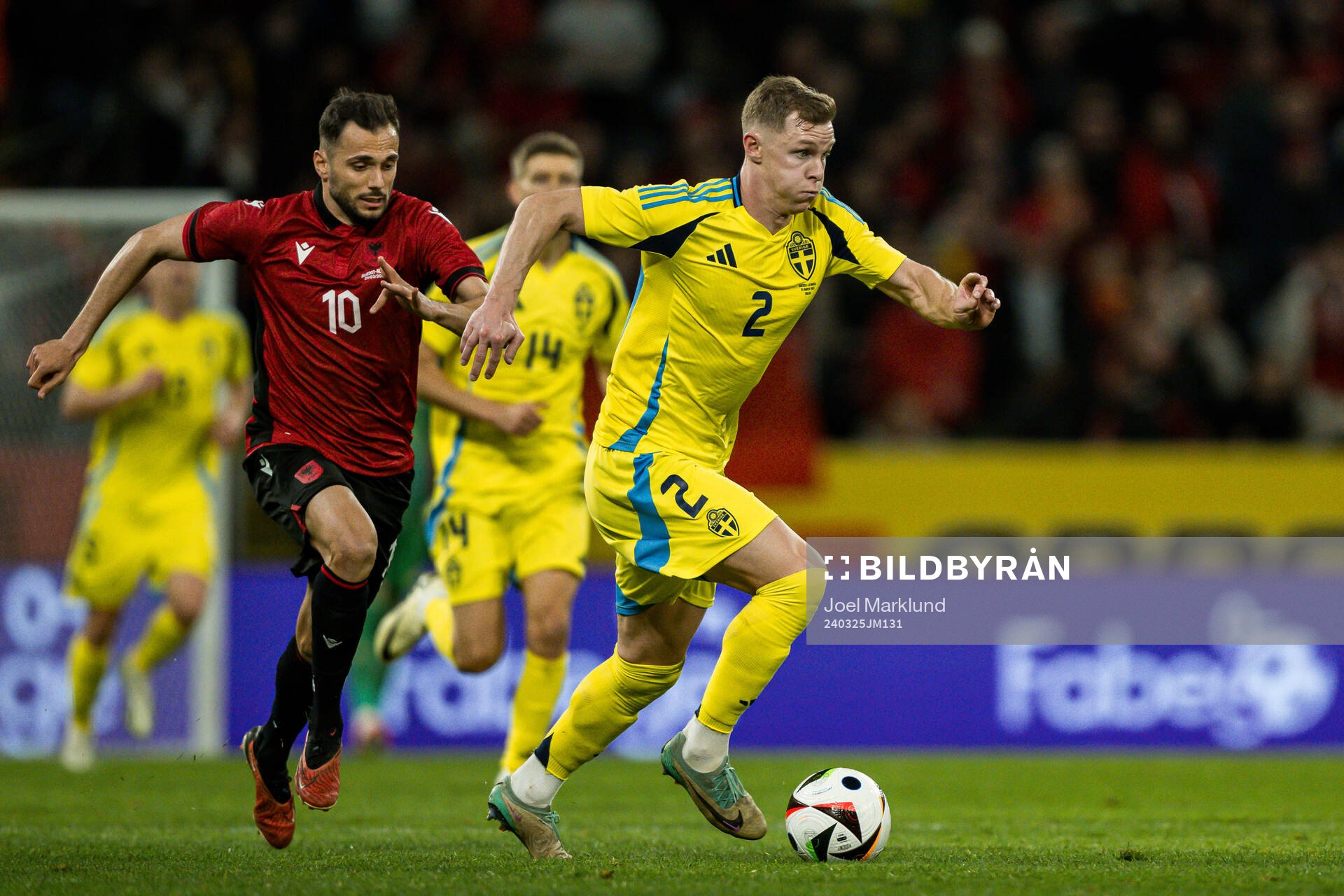 Nedim Bajrami of Albania and Emil Krafth of Sweden