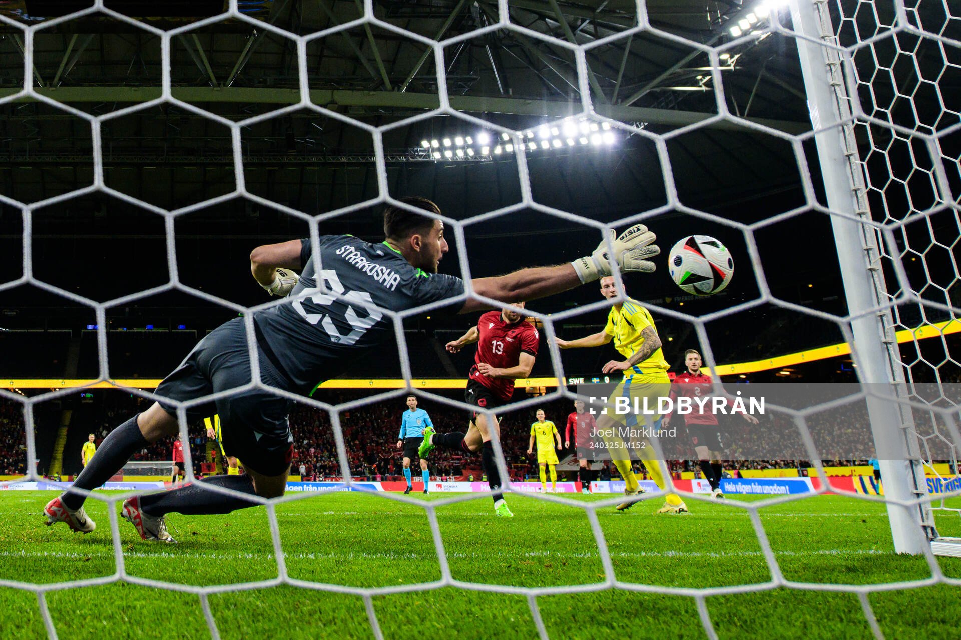 Gustaf Nilsson of Sweden scores 1-0 behind goalkeeper