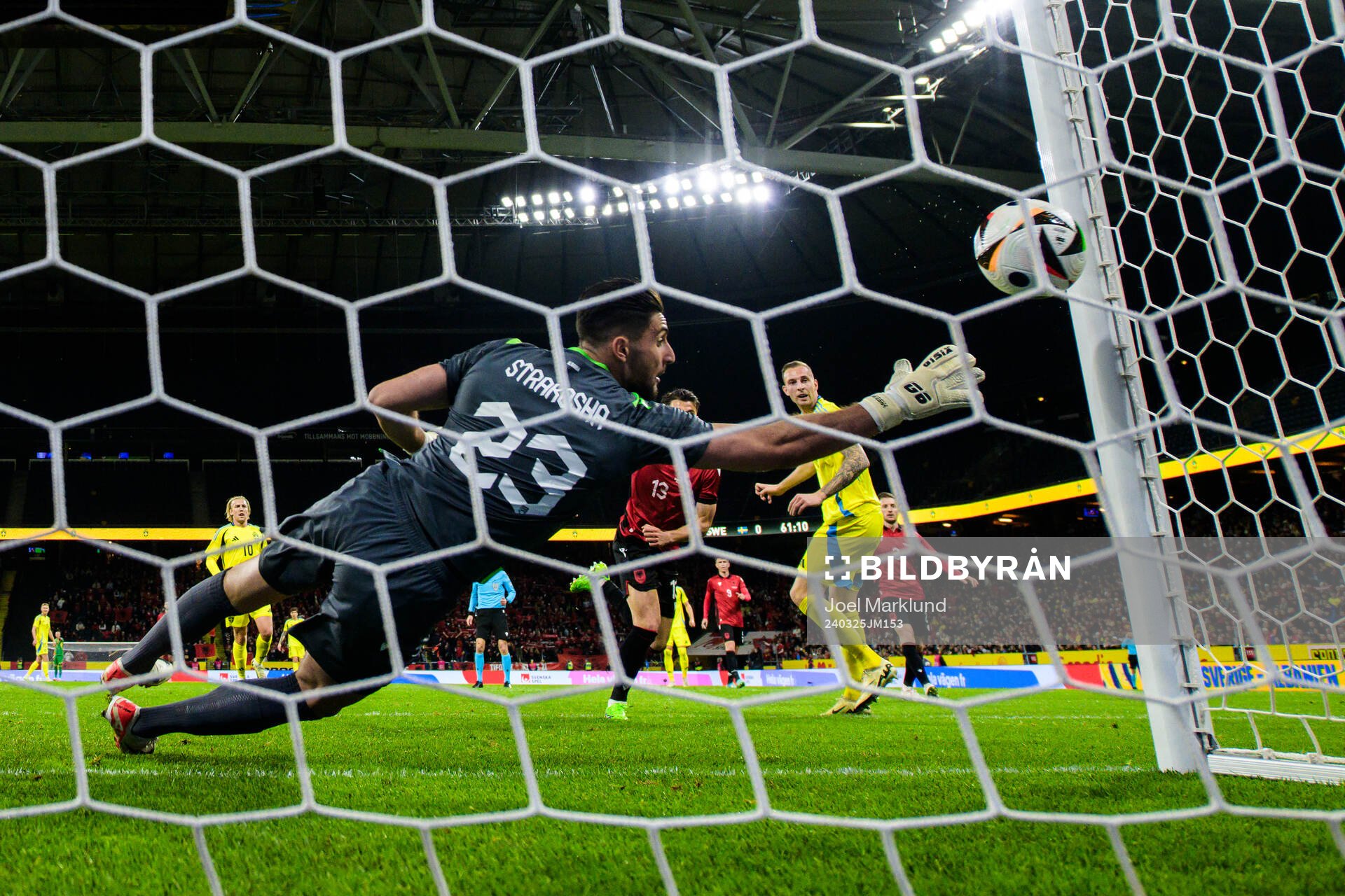 Gustaf Nilsson of Sweden scores 1-0 behind goalkeeper