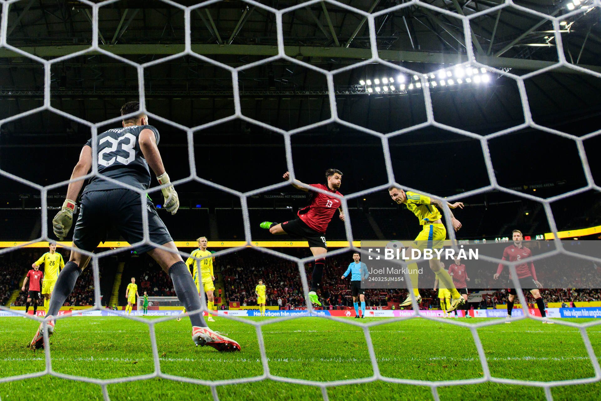 Gustaf Nilsson of Sweden scores 1-0 behind goalkeeper