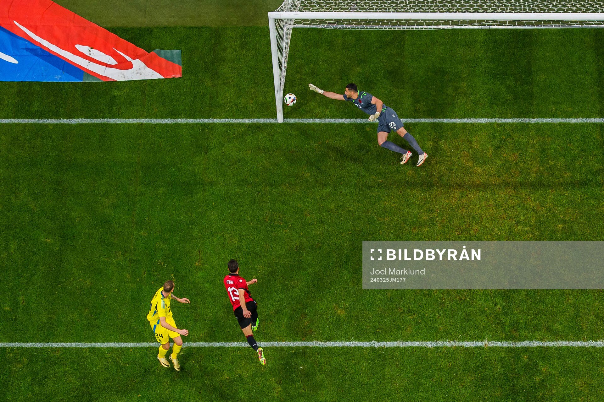 Gustaf Nilsson of Sweden scores 1-0 behind goalkeeper