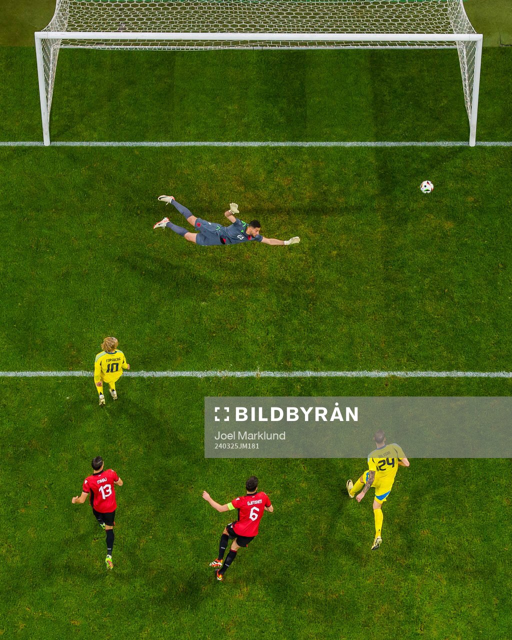 Emil Forsberg and Gustaf Nilsson of Sweden challenge Enea