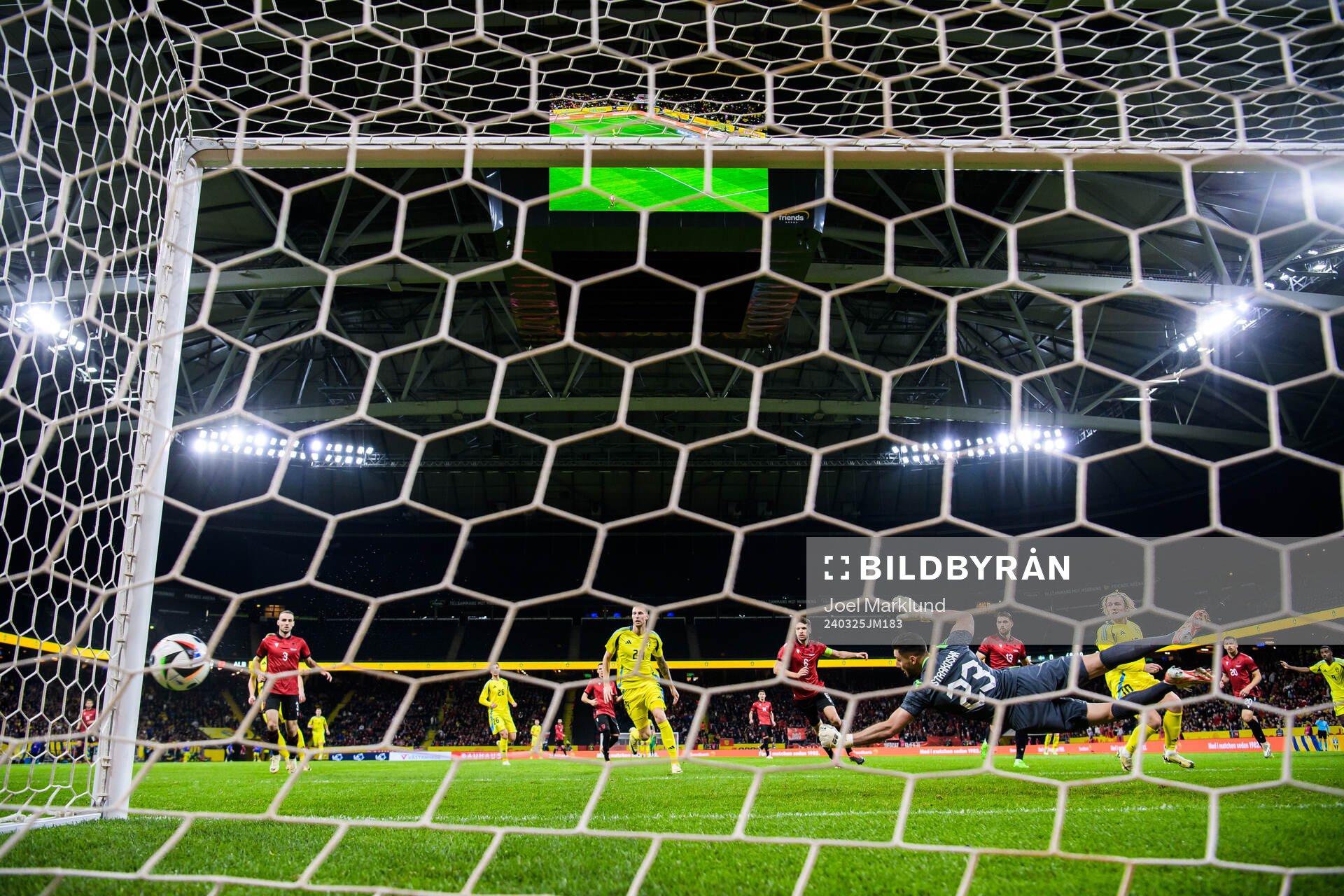 Gustaf Nilsson and Emil Forsberg of Sweden see the ball hit
