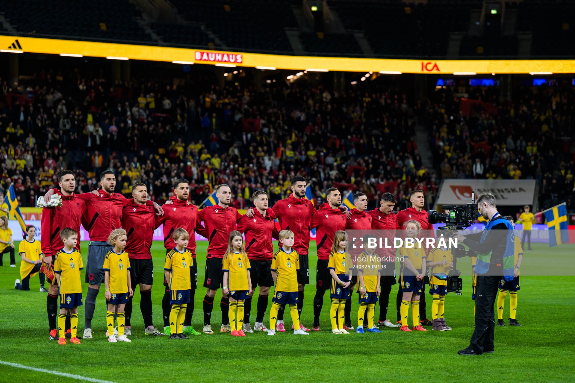 Players of of Albania sing their national anthem