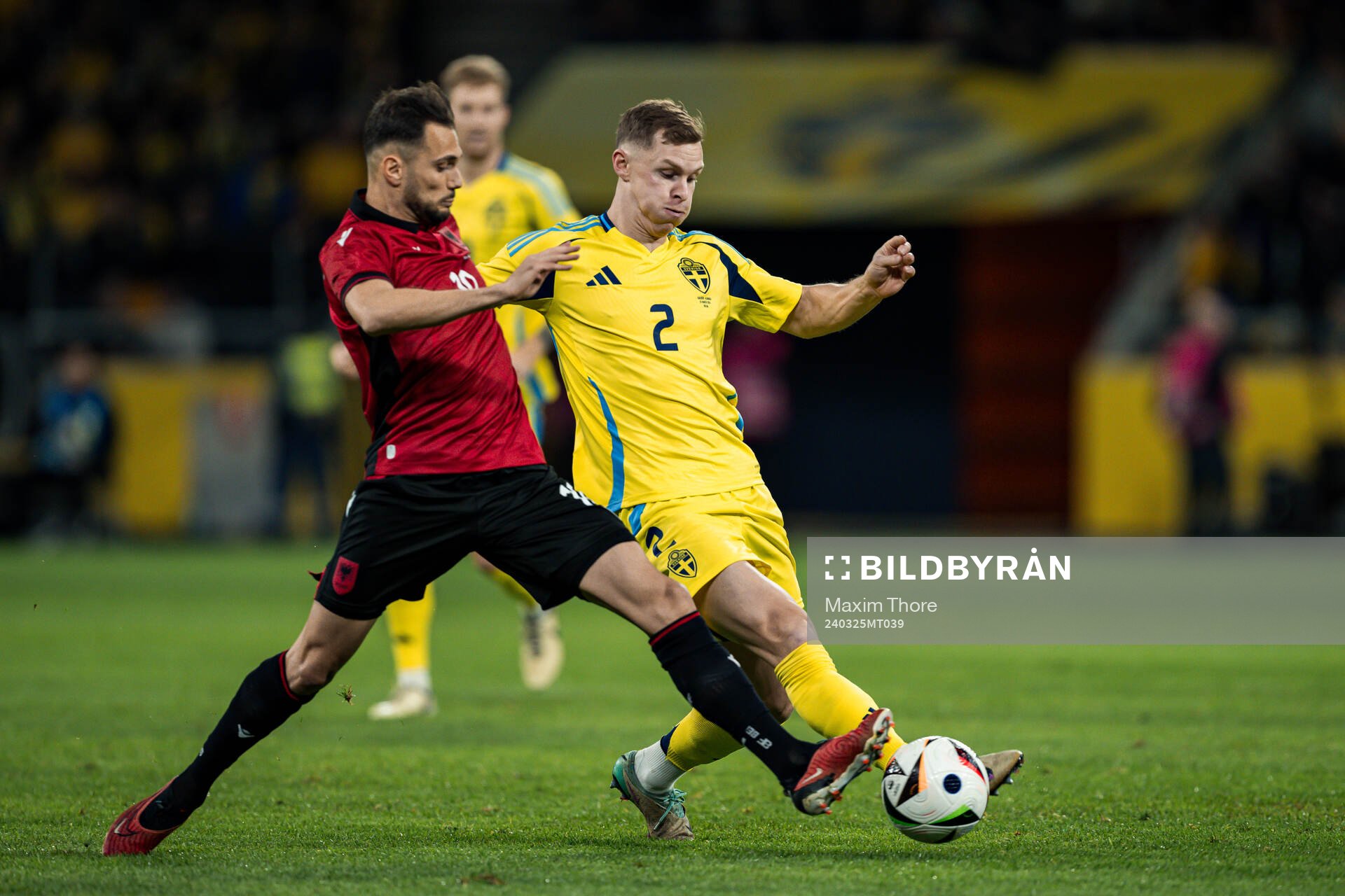Nedim Bajrami of Albania and Emil Krafth of Sweden