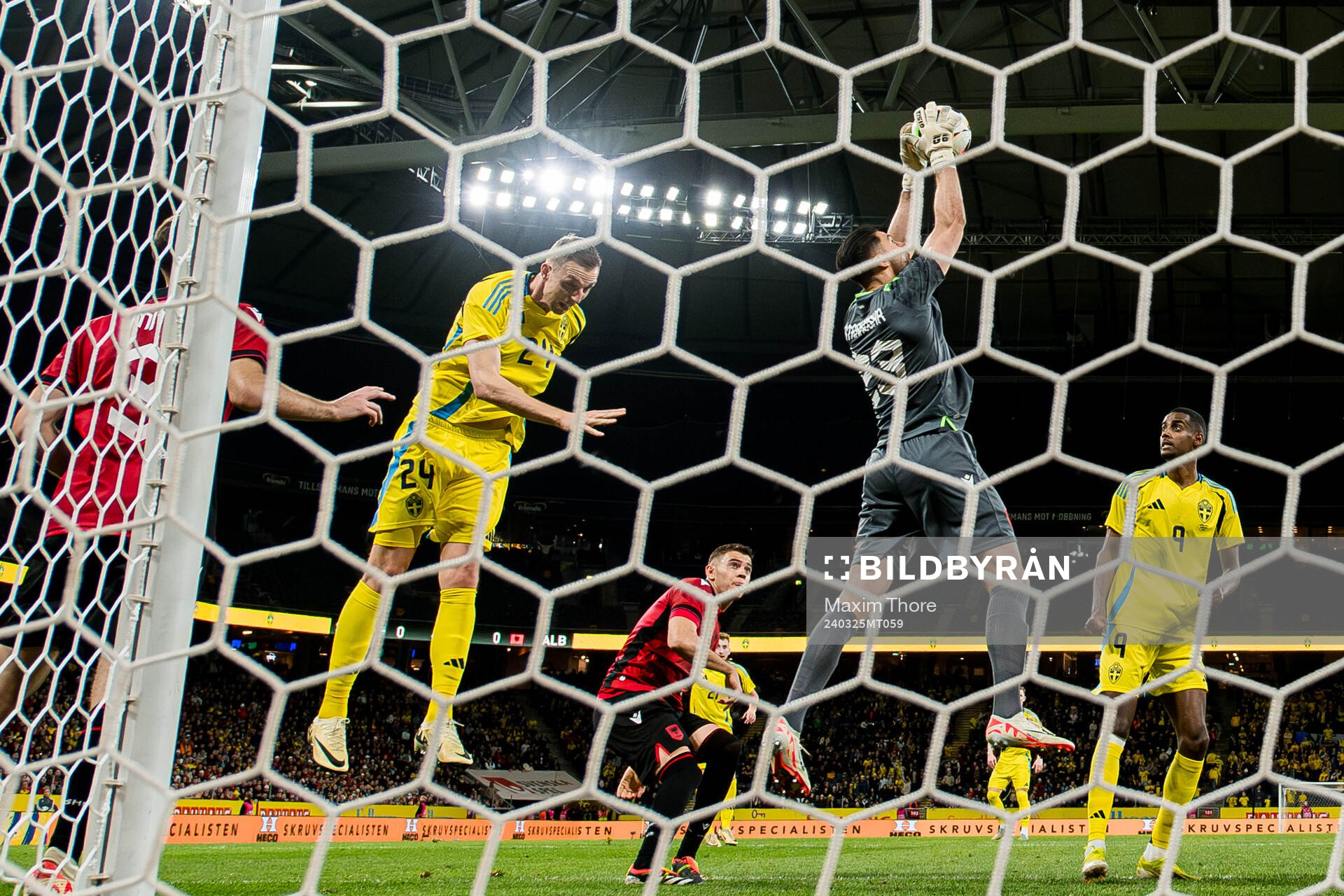 Gustaf Nilsson of Sweden against goalkeeper Thomas