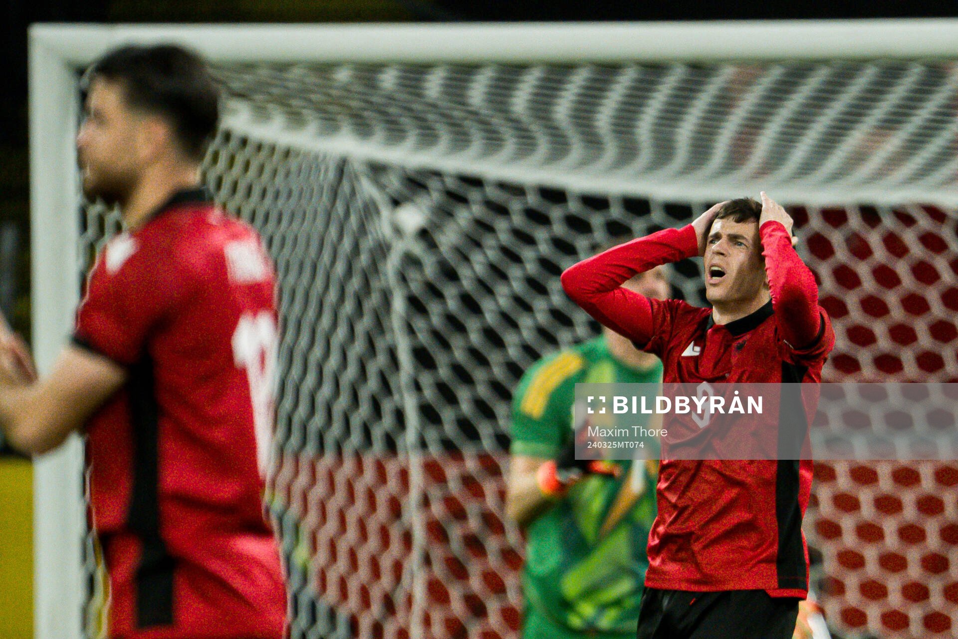 Jasir Asani of Albania looks dejected