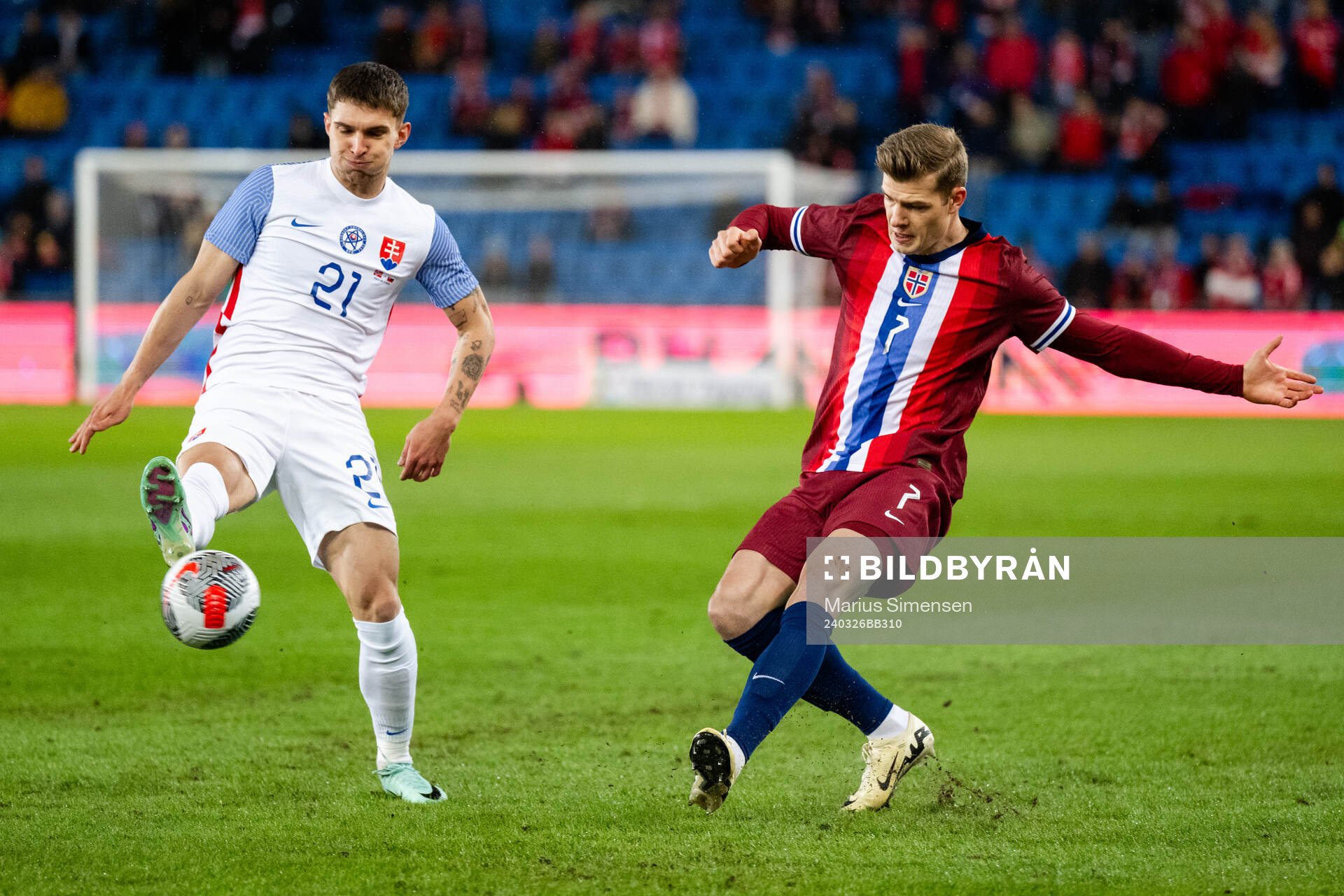 David Duris of Slovakia and Alexander Sørloth of Norway