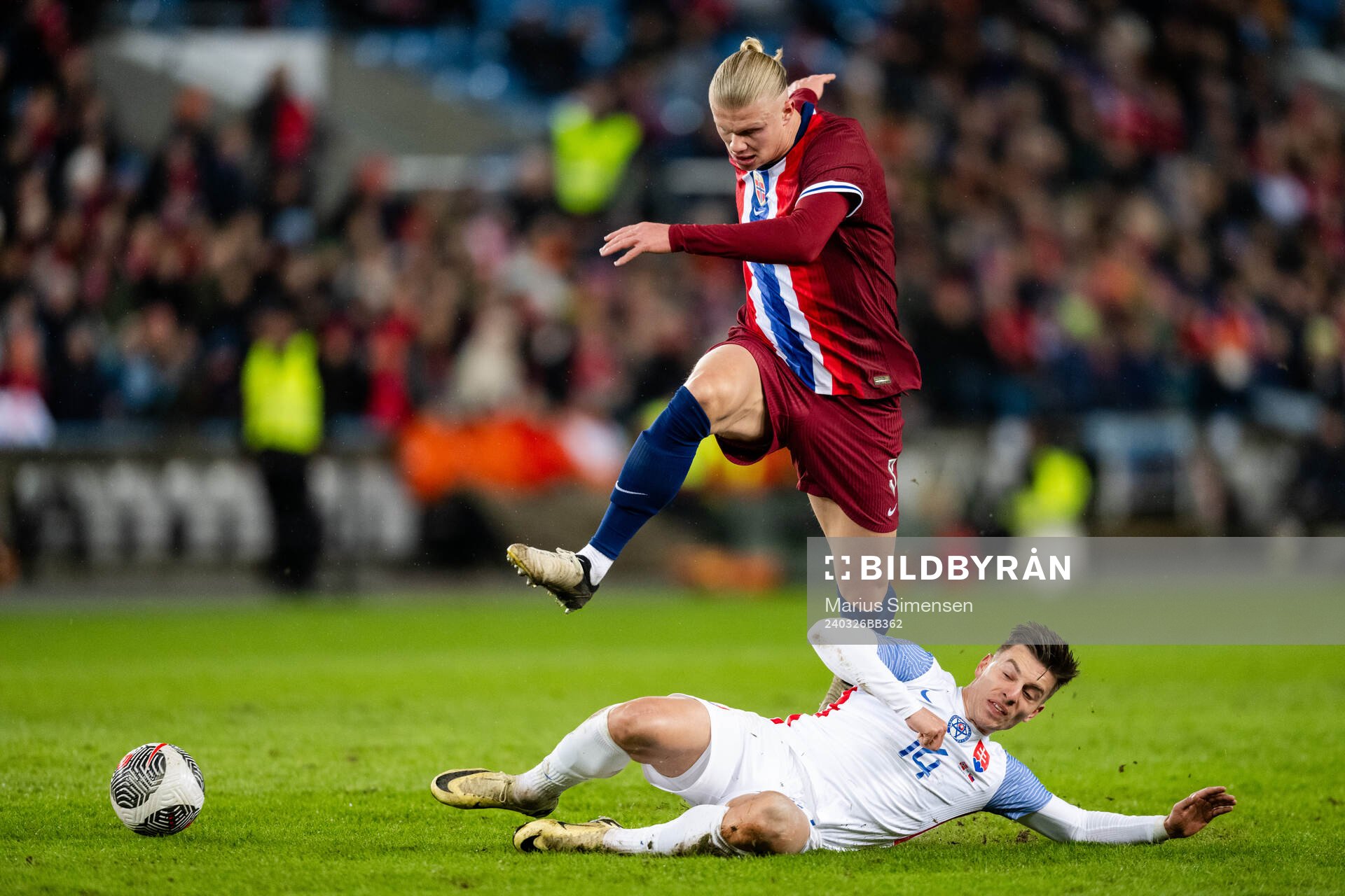 Erling Braut Haaland of Norway and Michal Tomic of Slovakia