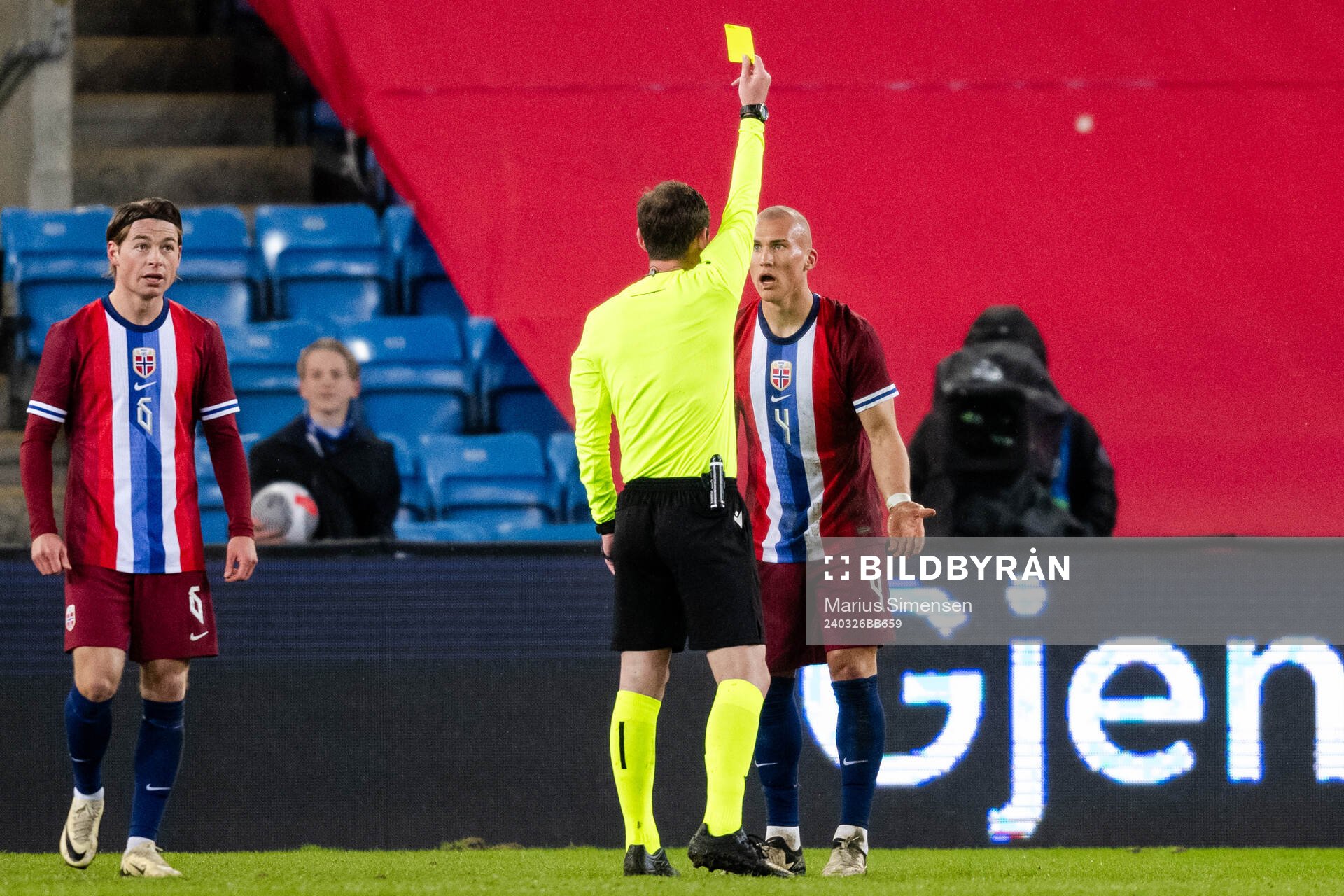 Leo Østigård of Norway receives a yellow card