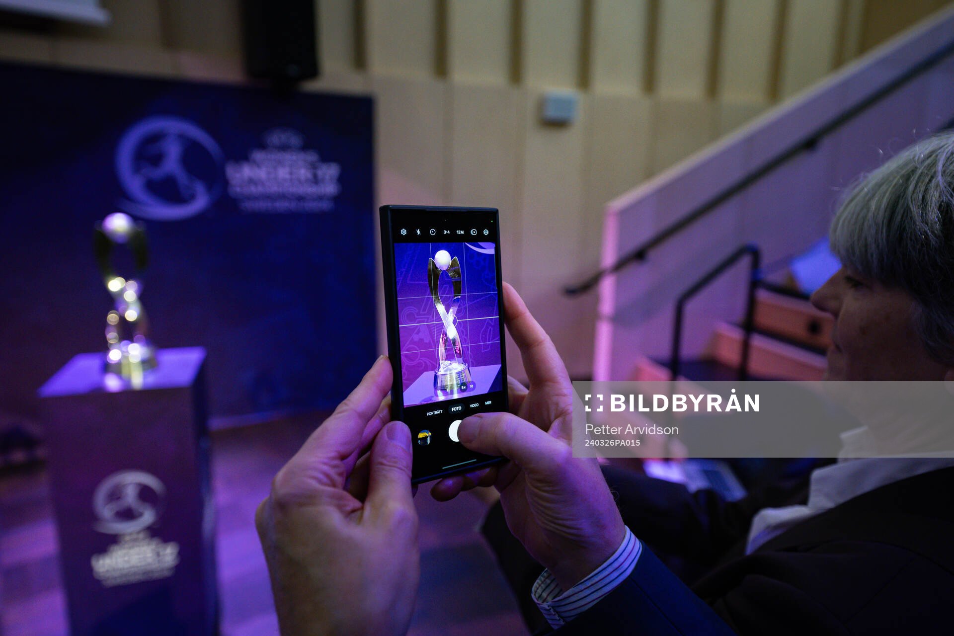 People take pictures of the Trophy