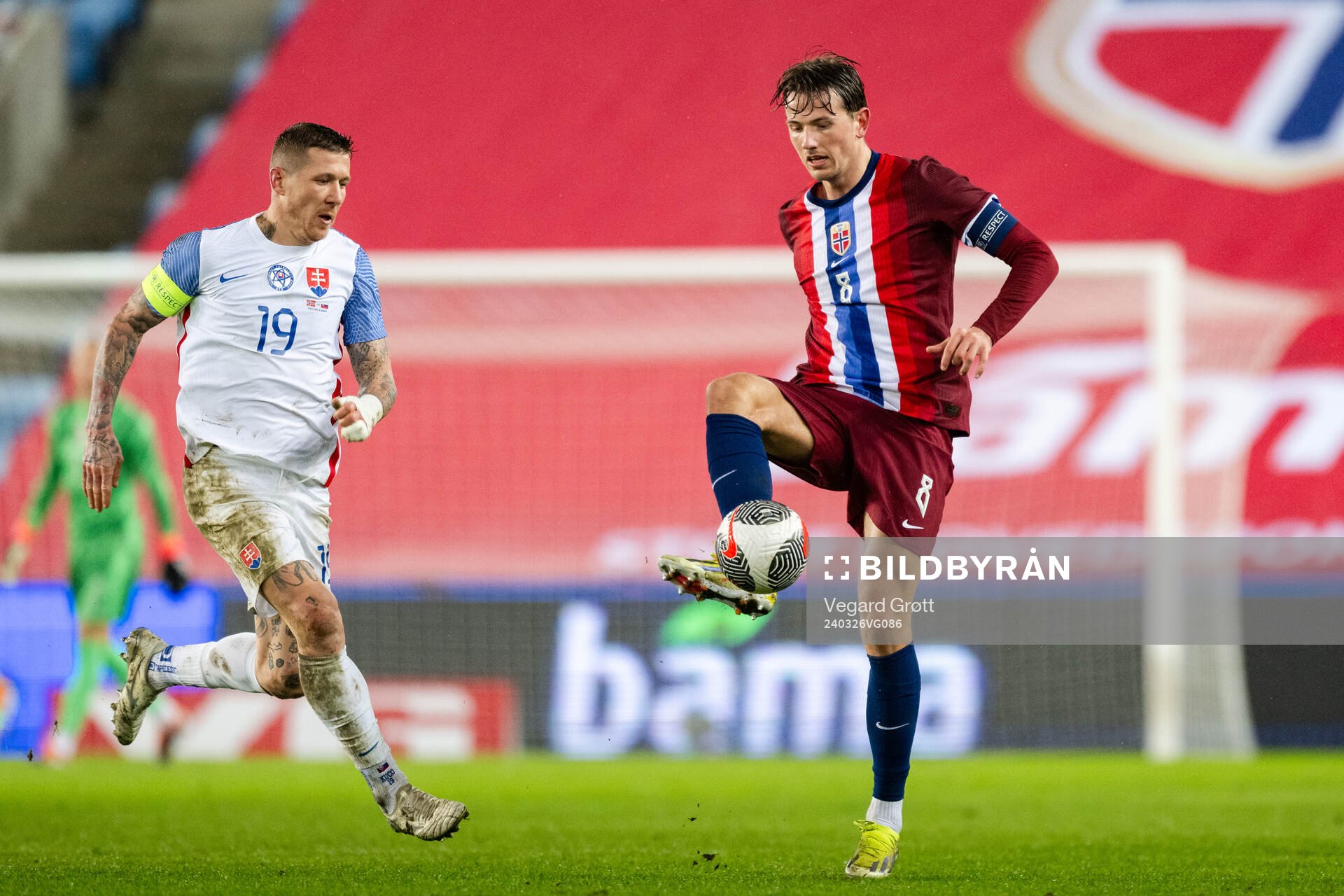 Juraj Kucka of Slovakia and Sander Berge +of Norway