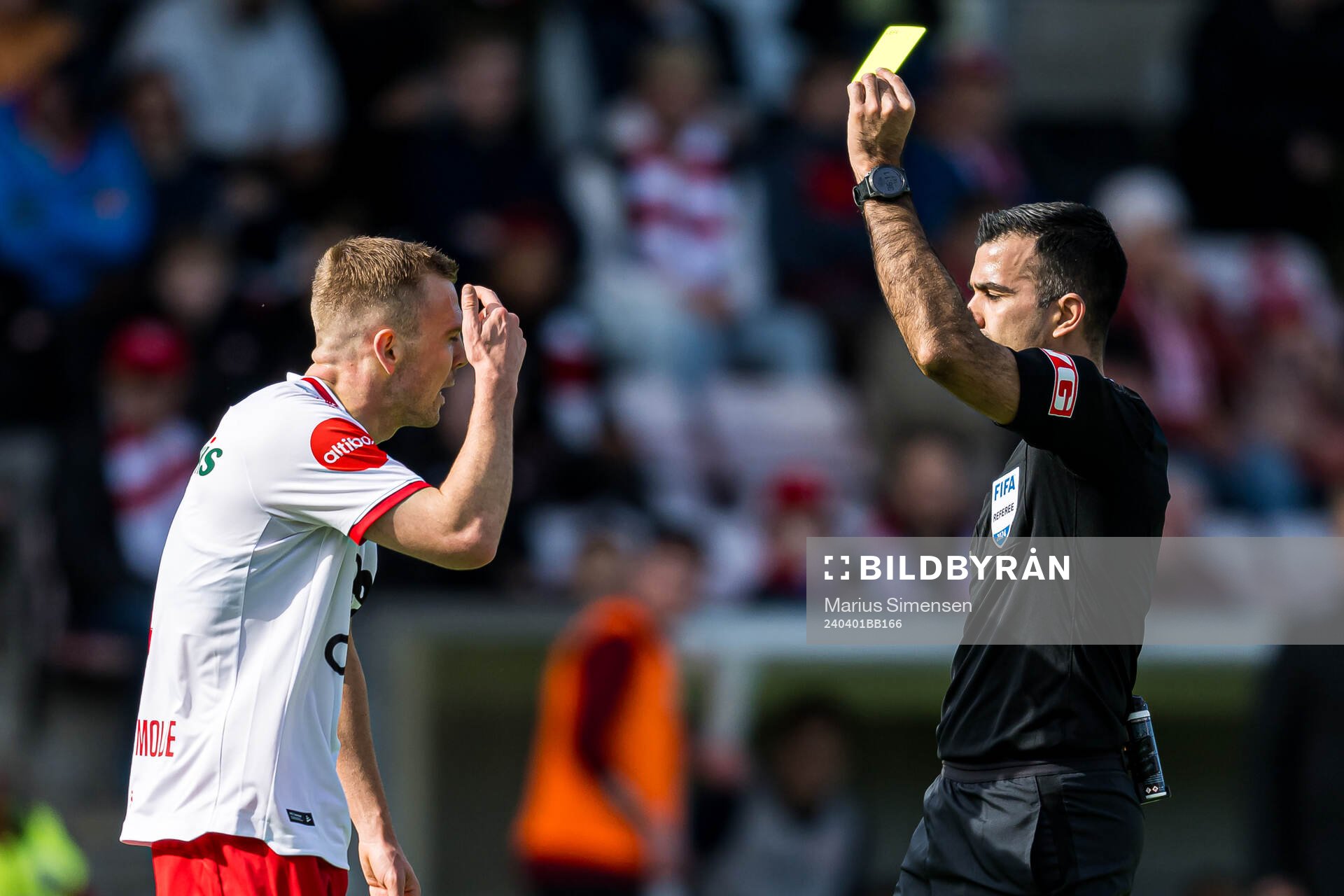 Stian Stray Molde of Fredrikstad after receiving a yellow card by Rohit Saggi, referee, during the Eliteserien match between Fredrikstad and Bodø/Glimt on April 1, 2024 in Fredrikstad.