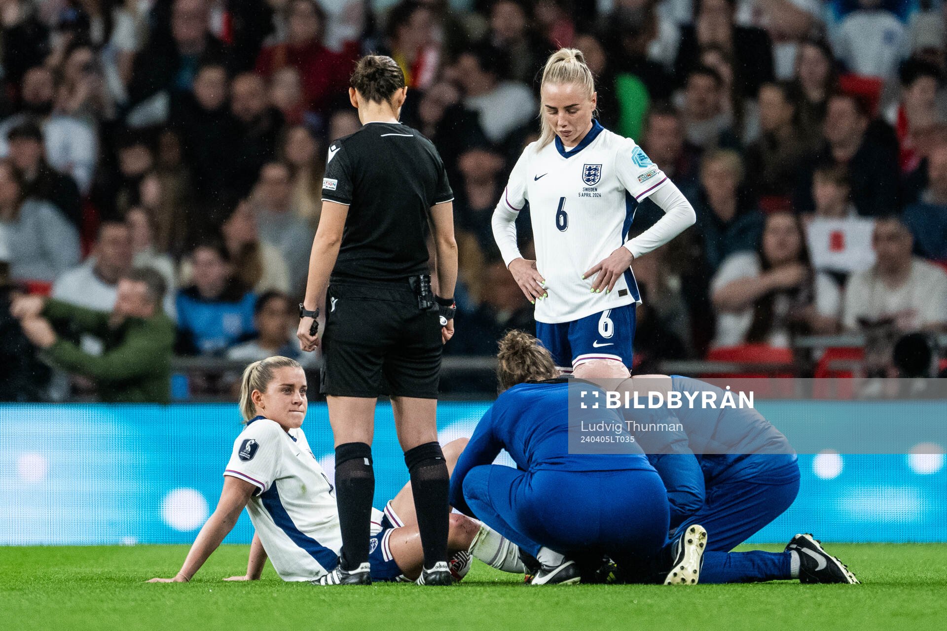 Keira Walsh of England receives medical attention